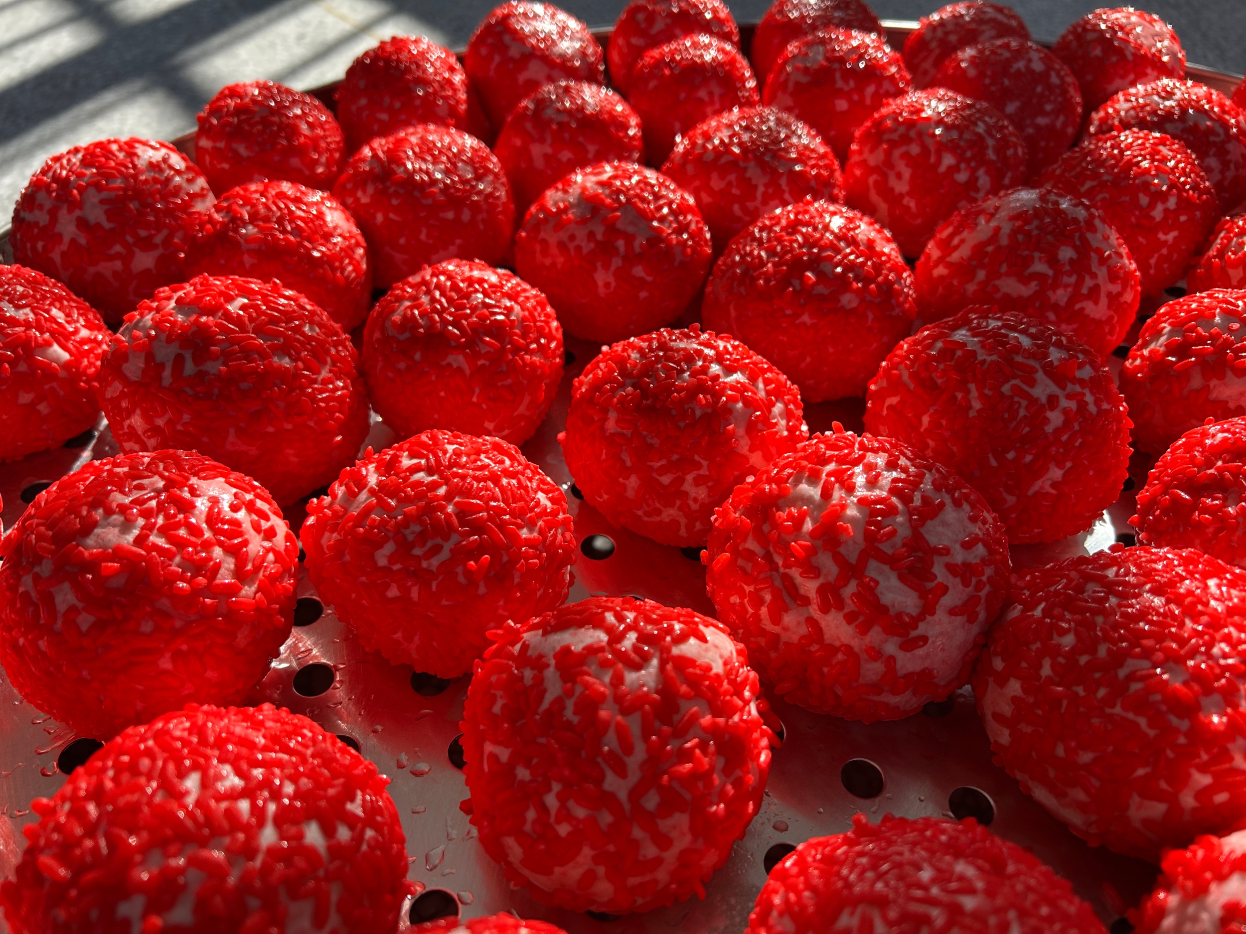 Red rice cakes are seen in Wengbei Village, Tongren City, southwest China's Guizhou Province, on January 8, 2026. /Tongren Media Convergence Center