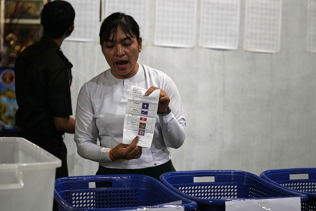 A Union Election Commission official counts ballots at a polling station in Yangon, Myanmar, January 11, 2026. /CFP