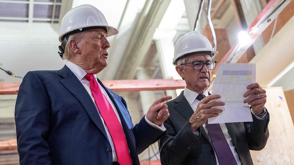 US President Donald Trump points to a cost sheet he had handed to Federal Reserve Chair Jerome Powell during their on-camera visit to the under-renovation Federal Reserve building in Washington, DC, US, on July 24, 2025. /VCG