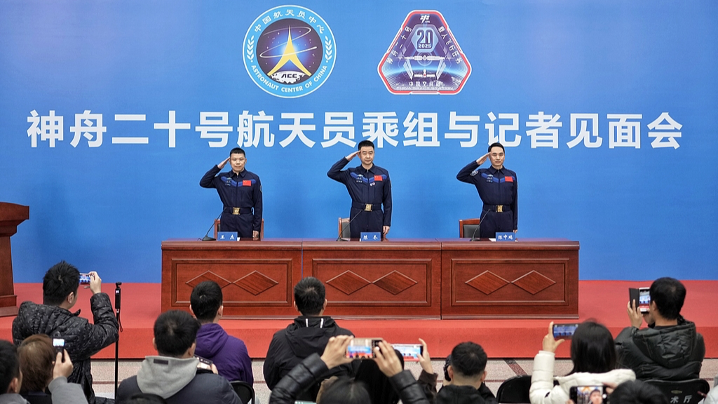 Astronauts from China's Shenzhou-20 crewed mission salute during a press conference in Beijing, China, January 16, 2026./ VCG