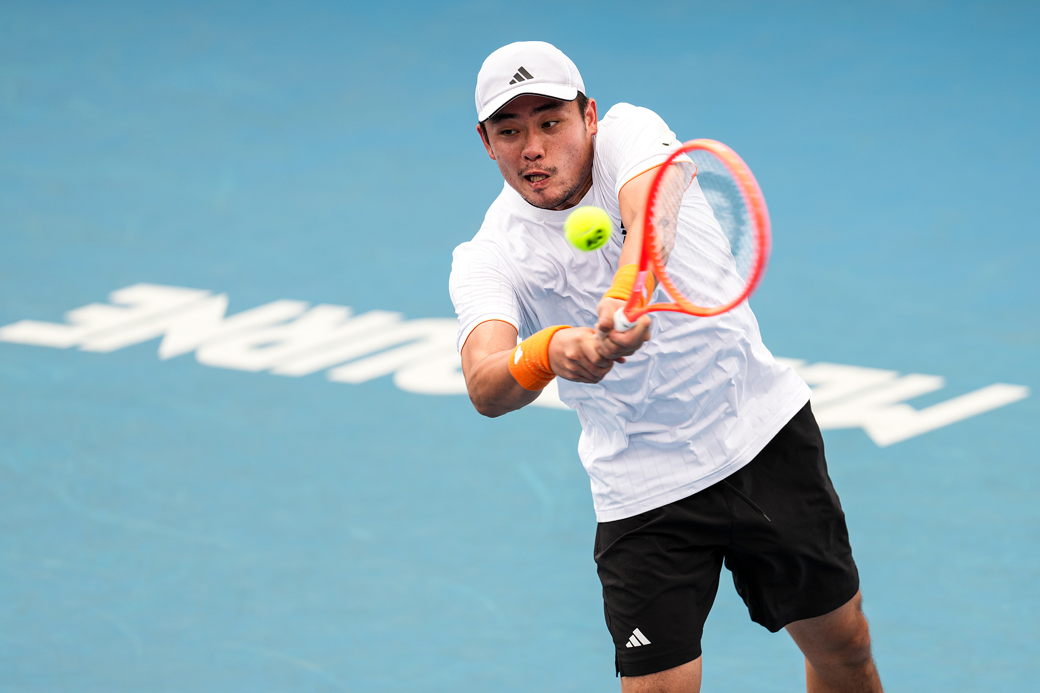 Wu Yibing hits a shot in the men's singles third-round match against Tristan Boyer of the U.S. in the Australian Open qualifying event at Melbourne Park in Melbourne, Australia, January 15, 2026. /VCG