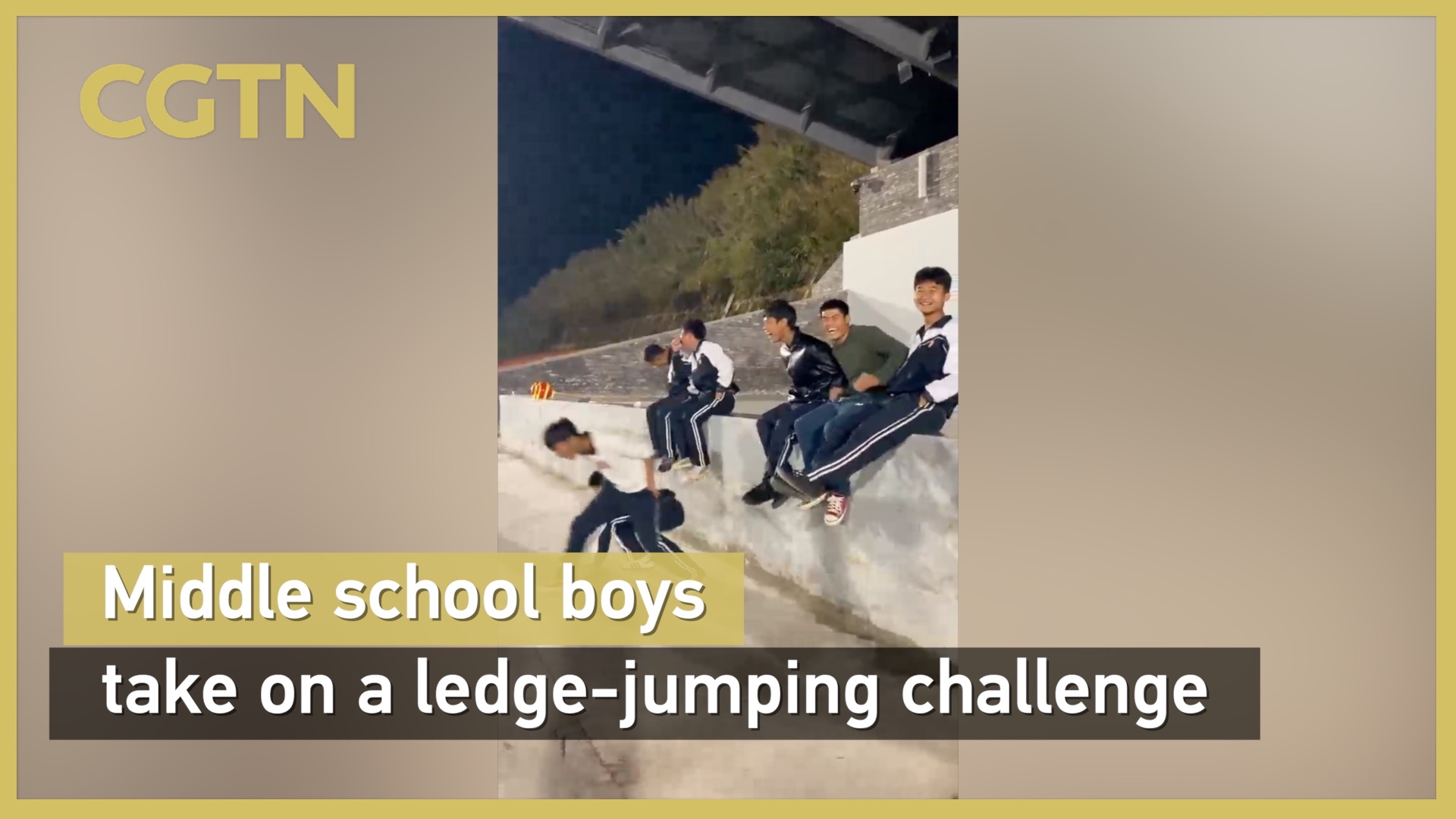 Middle school boys take on a ledge-jumping challenge