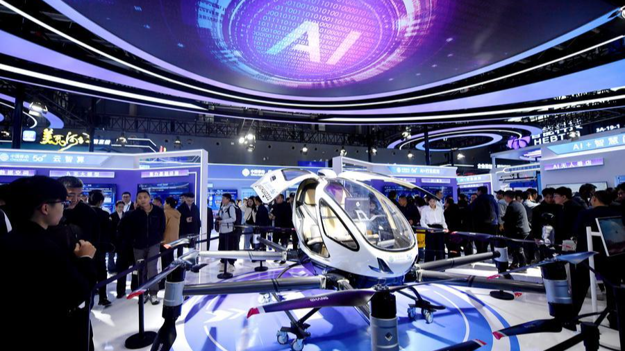 Visitors learn about a manned aircraft during the China International Digital Economy Expo 2025 in Shijiazhuang, northern Hebei Province, China, October 17, 2025. /Xinhua