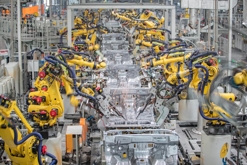 Intelligent welding robots are performing welding operations in a workshop of Great Wall Motors in Chongqing, China, March 18, 2023. /Xinhua  