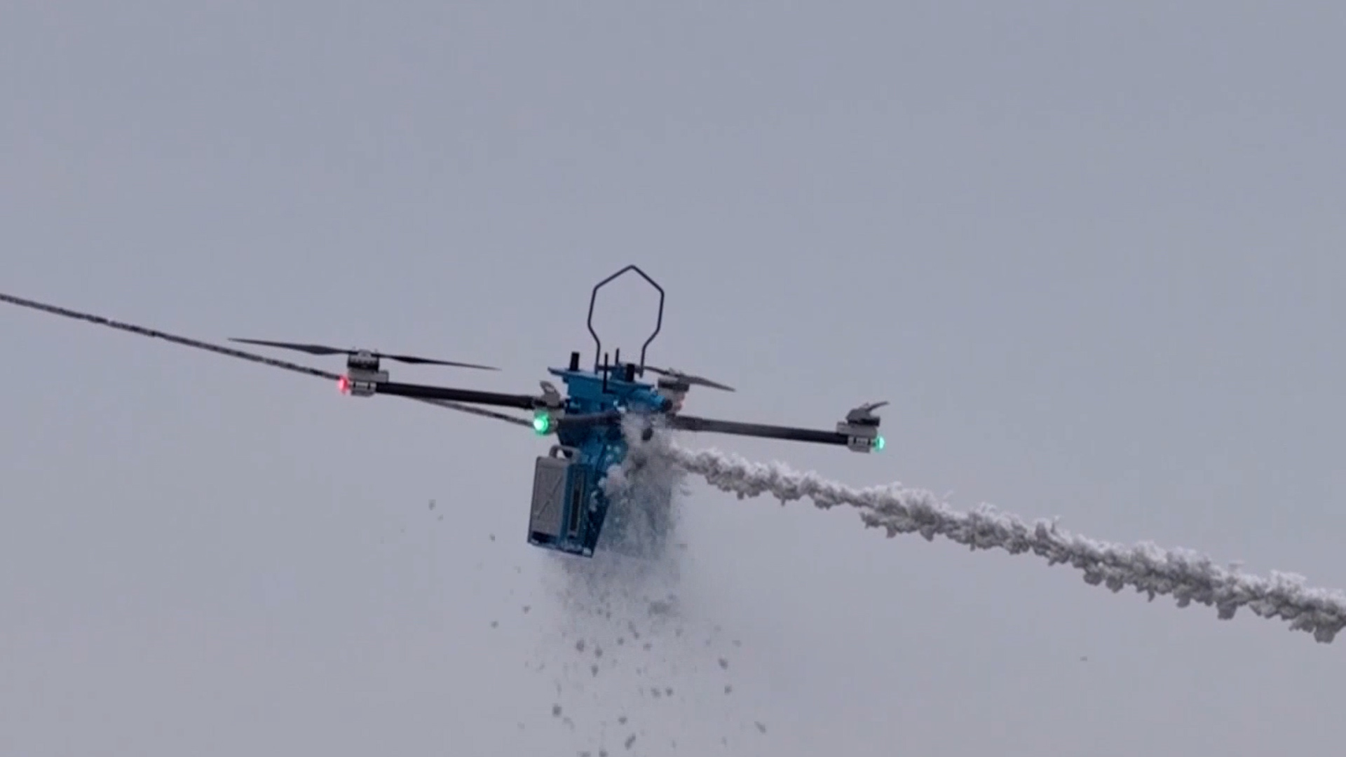 A four-rotor de-icing robot shaves off ice on a power cable near Suizhou City, central China's Hubei Province, January 20, 2026. /China Media Group