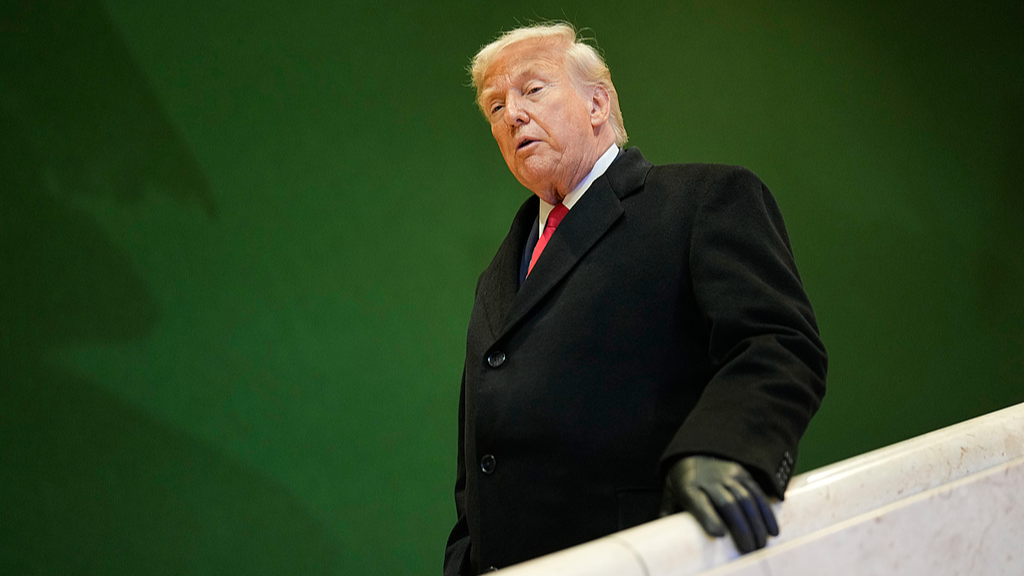 U.S. President Donald Trump walks down stairs after a meeting during the Annual Meeting of the World Economic Forum in Davos, Switzerland, January 21, 2026. /VCG