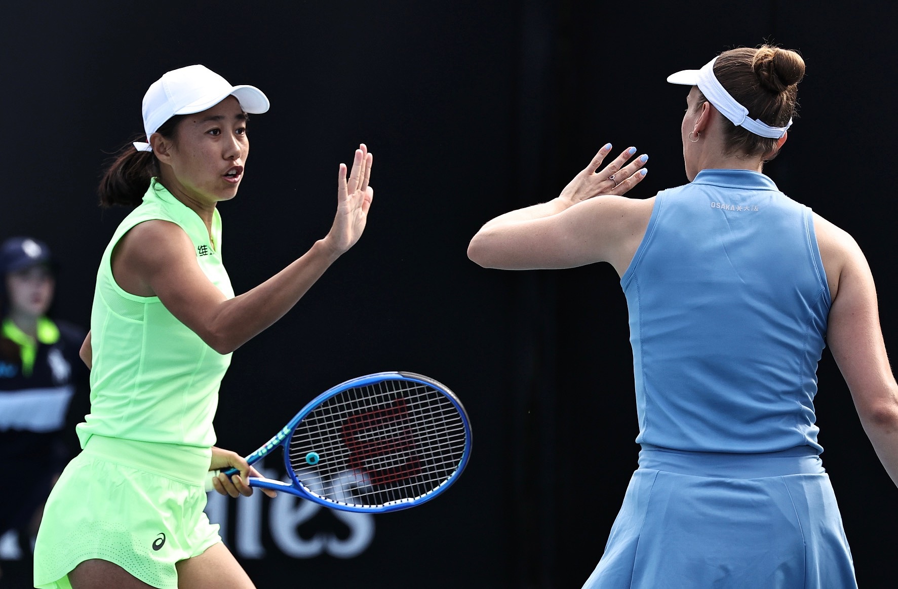 China's Zhang Shuai and Belgium's Elise Mertens celebrate after converting a point against Romania's Sorana Cirstea and Russia's Anna Kalinskaya in a women's doubles match at the Australian Open in Melbourne, January 21, 2026. /VCG