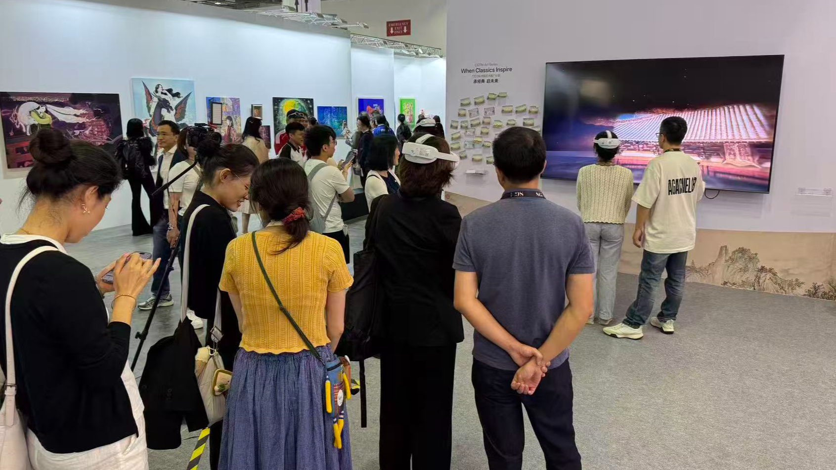 Art enthusiasts explore digital exhibitions of the CGTN Art Series at ART SG in Singapore, January 23, 2026. /CGTN