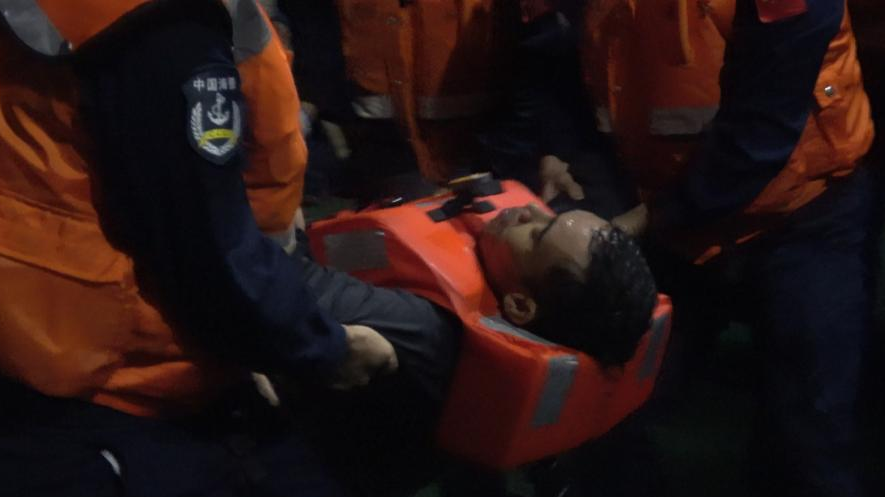 A Filipino crew member is rescued by the China Coast Guard on January 23, 2026. /China Coast Guard