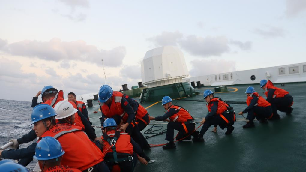 Members of the China Coast Guard carry out a rescue operation after a foreign cargo ship capsized in the territorial waters of south China's Huangyan Dao, on January 23, 2026.  /China Coast Guard