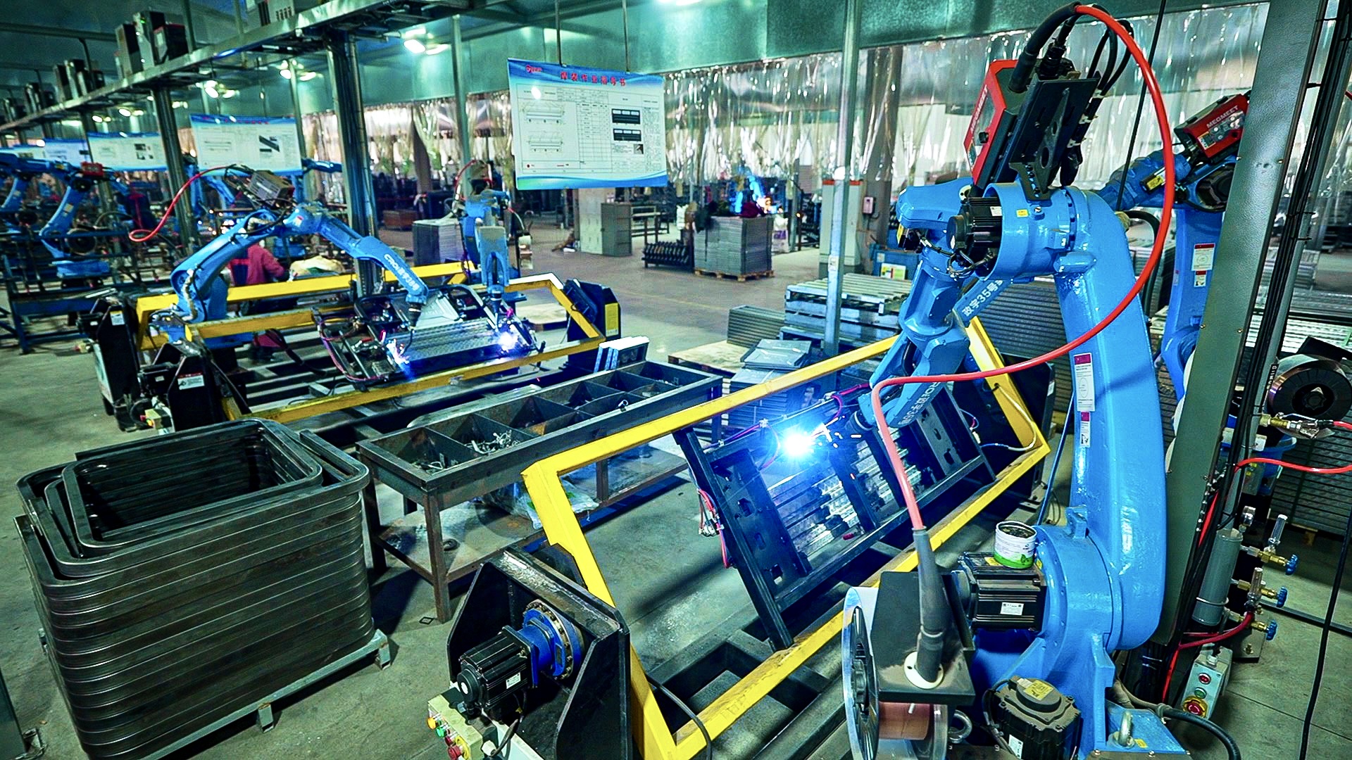 China-made robotic arms in action making electric tricycles in Sichuan, China, January 14, 2026. /CGTN