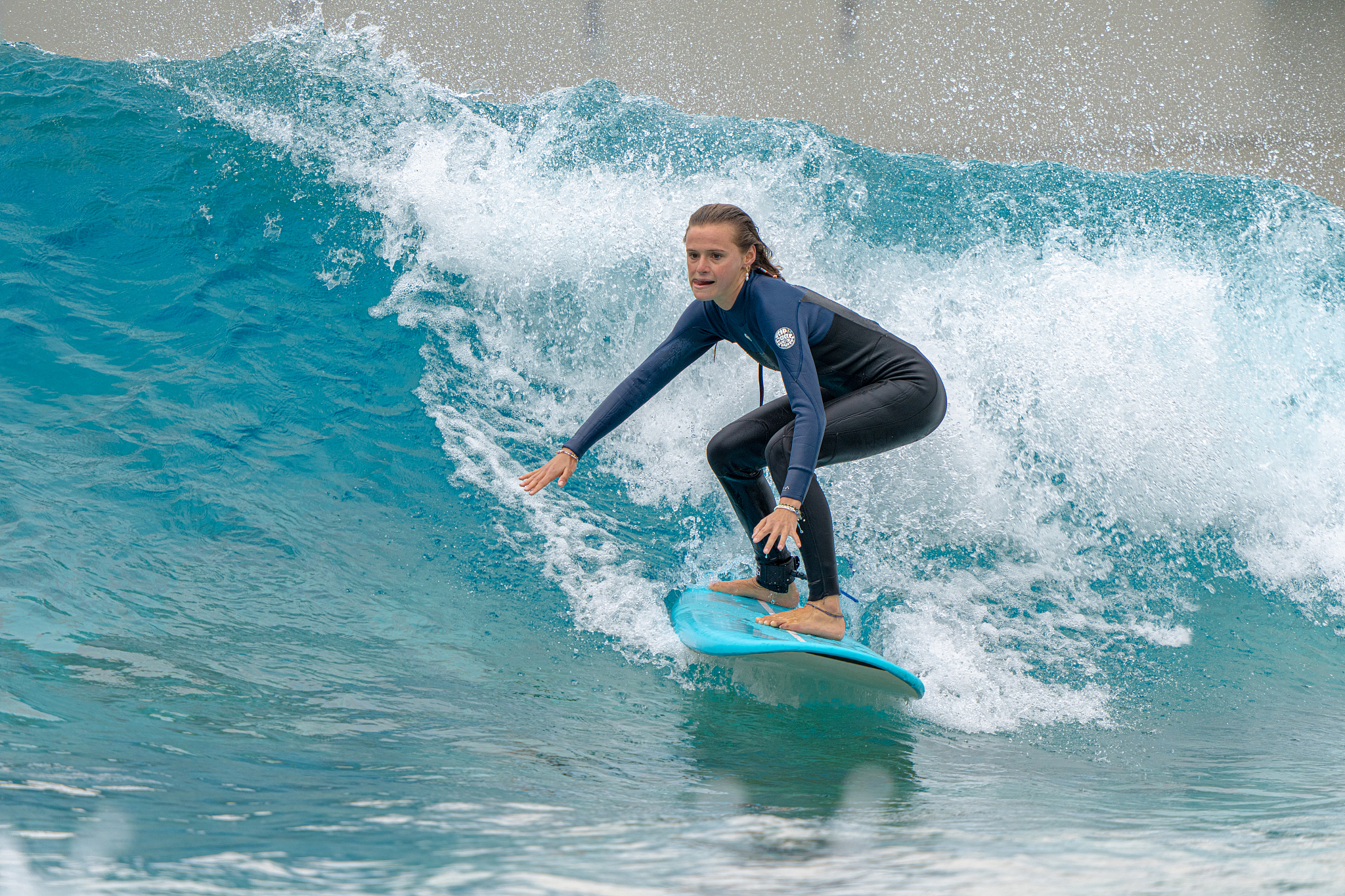 A surfer in Riyue bay, Wanning, Hainan, January 24, 2026. /VCG