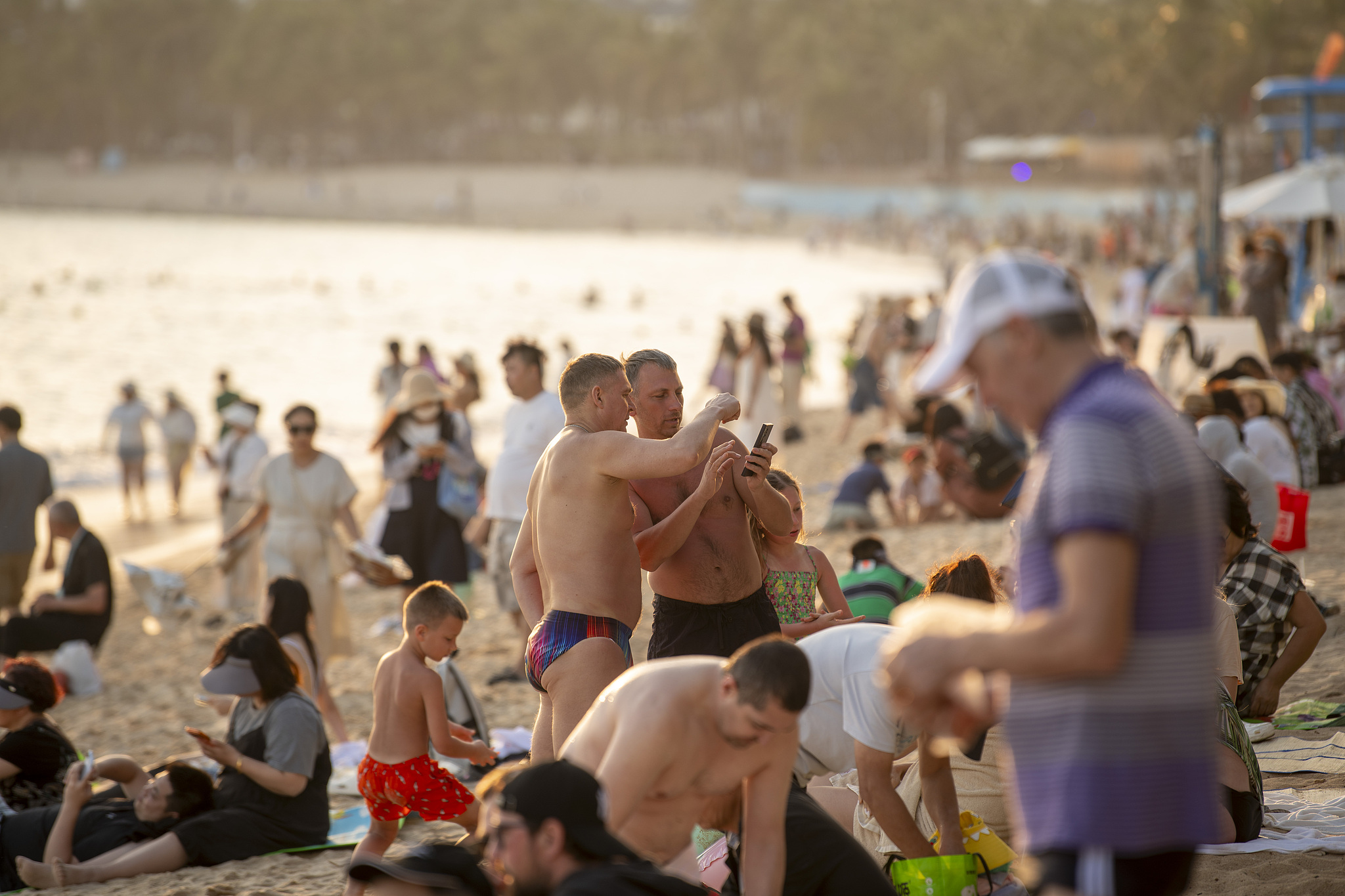 Tourists are enjoying the beach in Sanya, Hainan, January 22, 2026. /VCG
