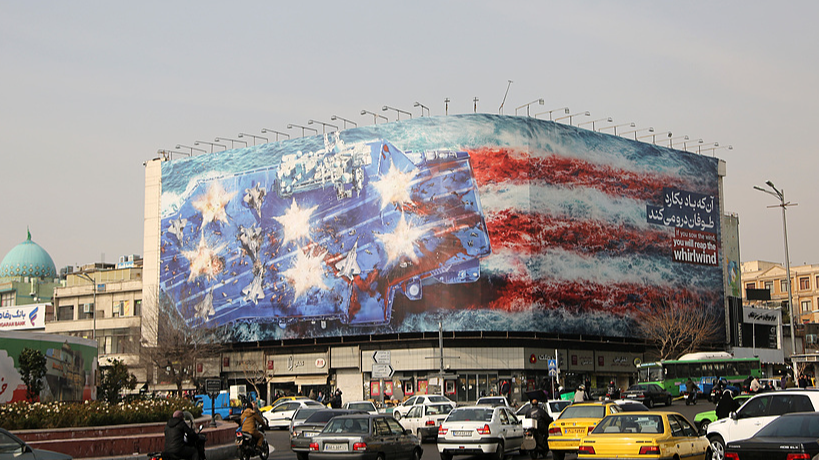 A giant banner depicting a U.S. aircraft carrier and the American flag was displayed at Enqelab (Revolution) Square in Tehran, Iran, January 25, 2026. /VCG