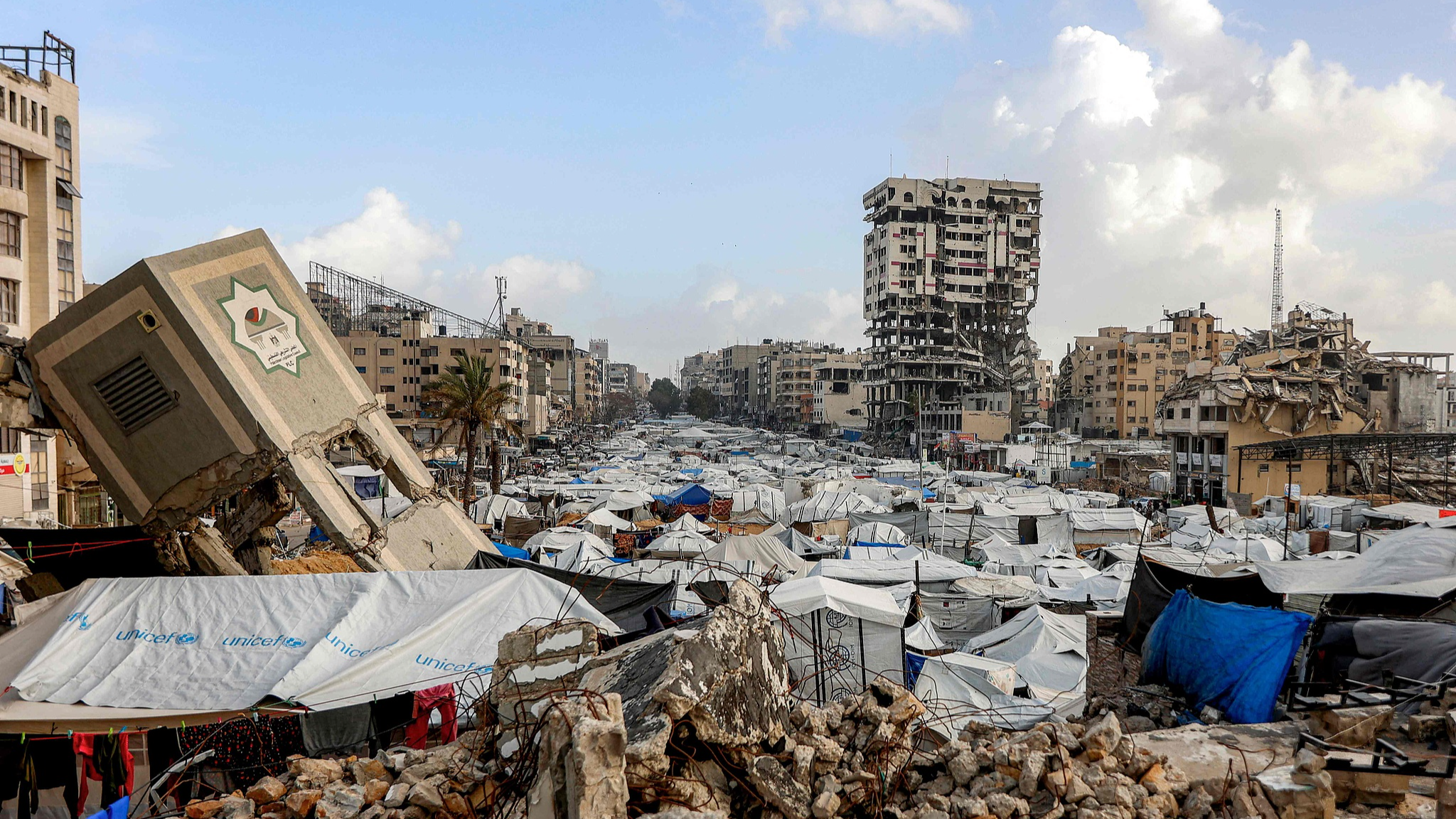 Tents and shelters are pictured at a camp for people displaced by conflict amidst the rubble of the former headquarters of the Palestinian Legislative Council (PLC) and near the Unknown Soldier Square in Gaza City, January 28, 2026. /VCG