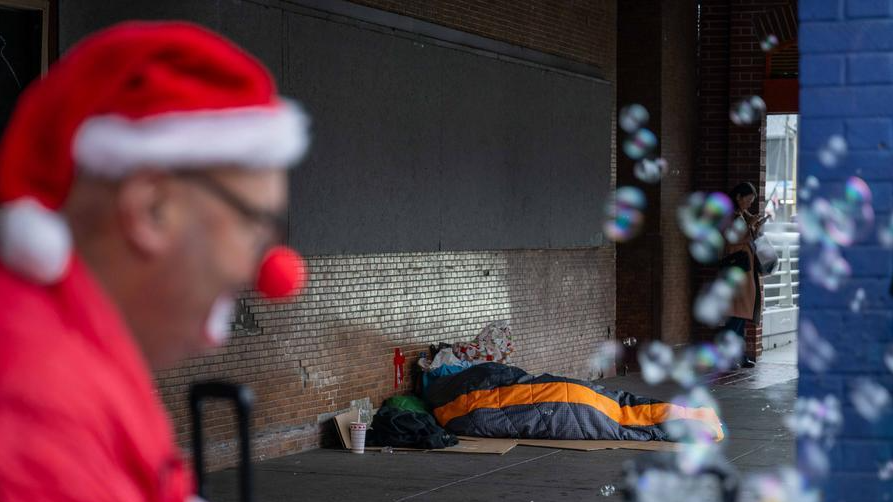 A homeless man lies on the street in San Francisco, the United States, December 31, 2025. /Xinhua