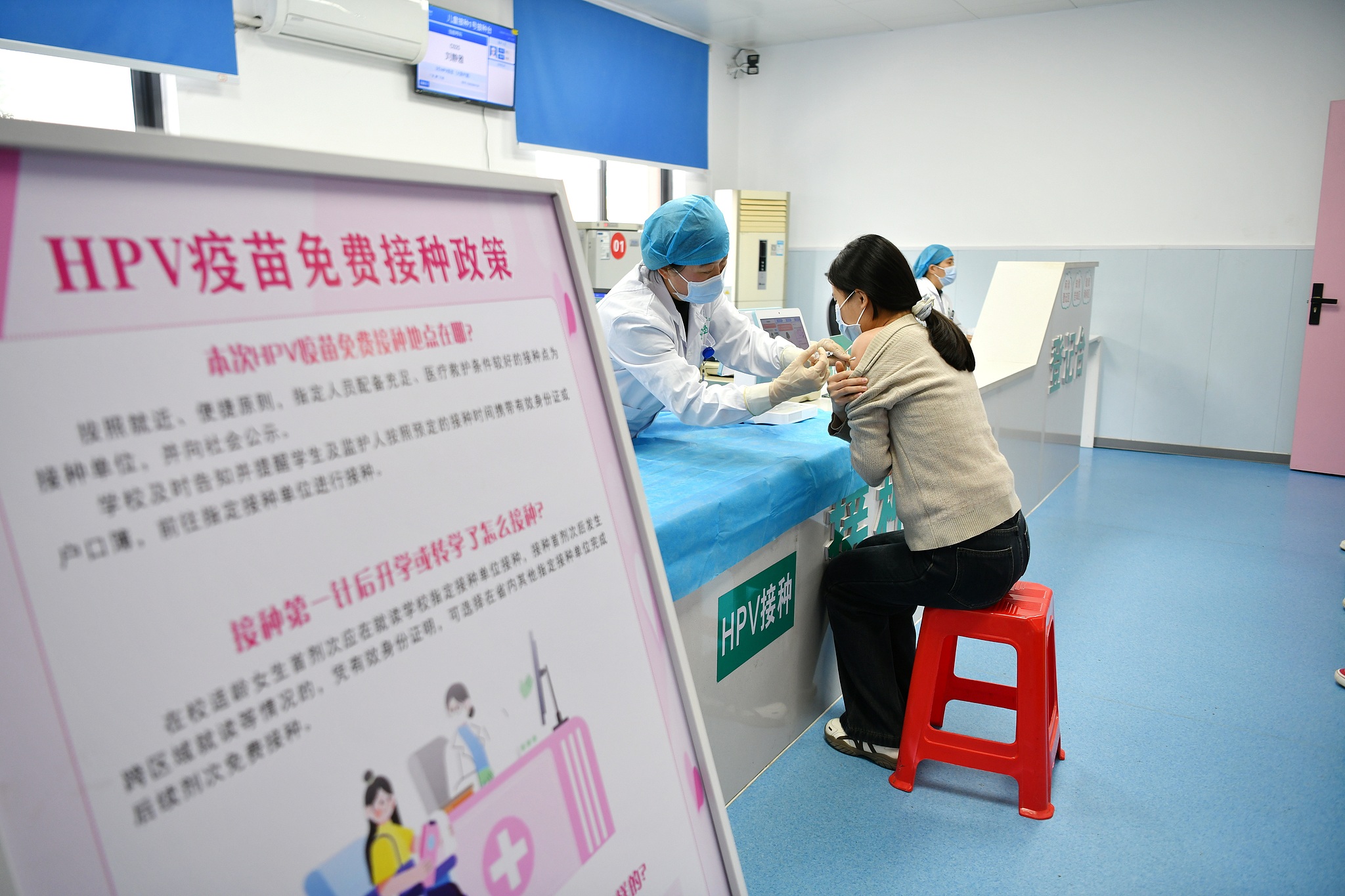 A medical staff member at the Miaoji Town Health Center in Funan County, Fuyang City, east China's Anhui Province, administers free HPV vaccination to an eligible female student, November 10, 2025. /VCG