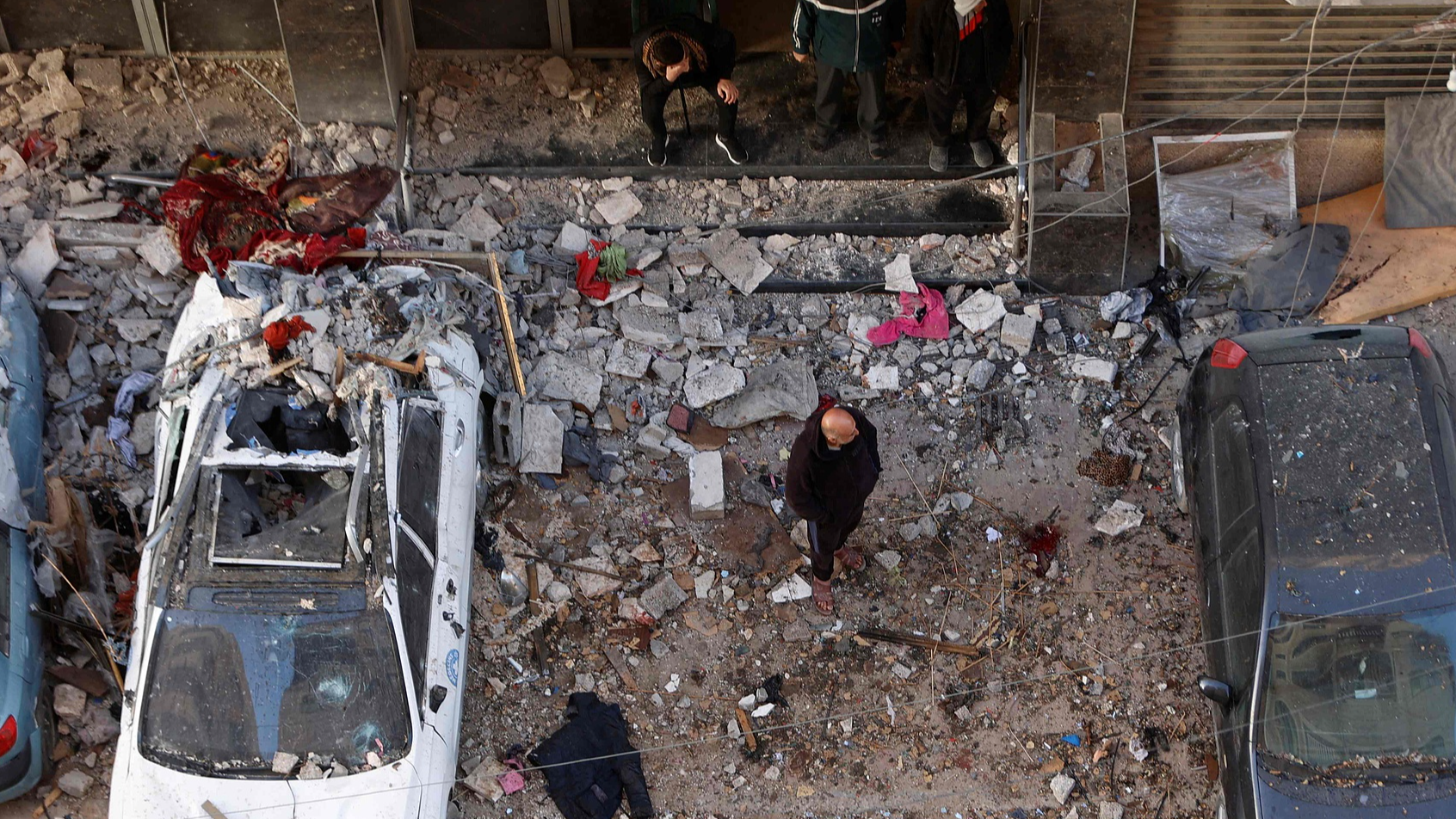 A Palestinian man inspects the site following an Israeli strike on Gaza City, January 31, 2026. /VCG