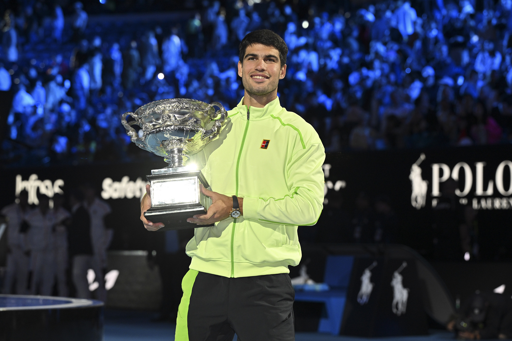 Carlos Alcaraz of Spain holds the championship trophy after defeating Novak Djokovic of Serbia in the men's singles final at the Australian Open in Melbourne, Australia, February 1, 2026. /VCG