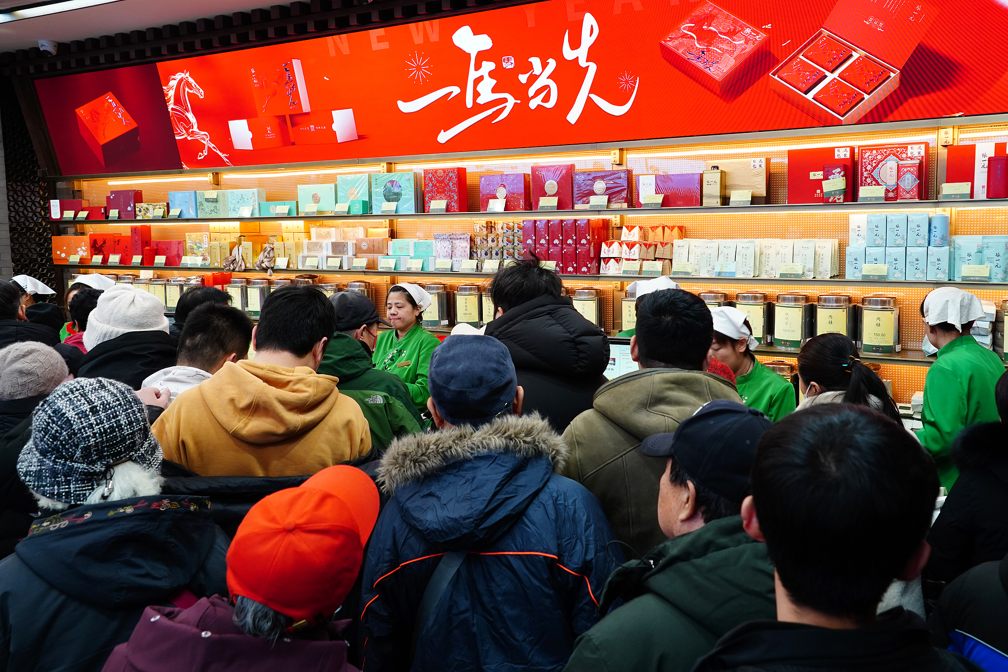 Consumers line up to buy Spring Festival goods at a store in Beijing, China, February 2, 2026. /VCG