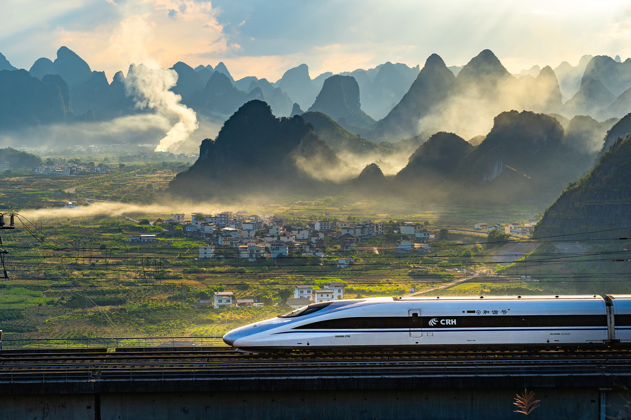 Yangshuo's popular high-speed rail against the backdrop of Guilin's landscape, China. /VCG