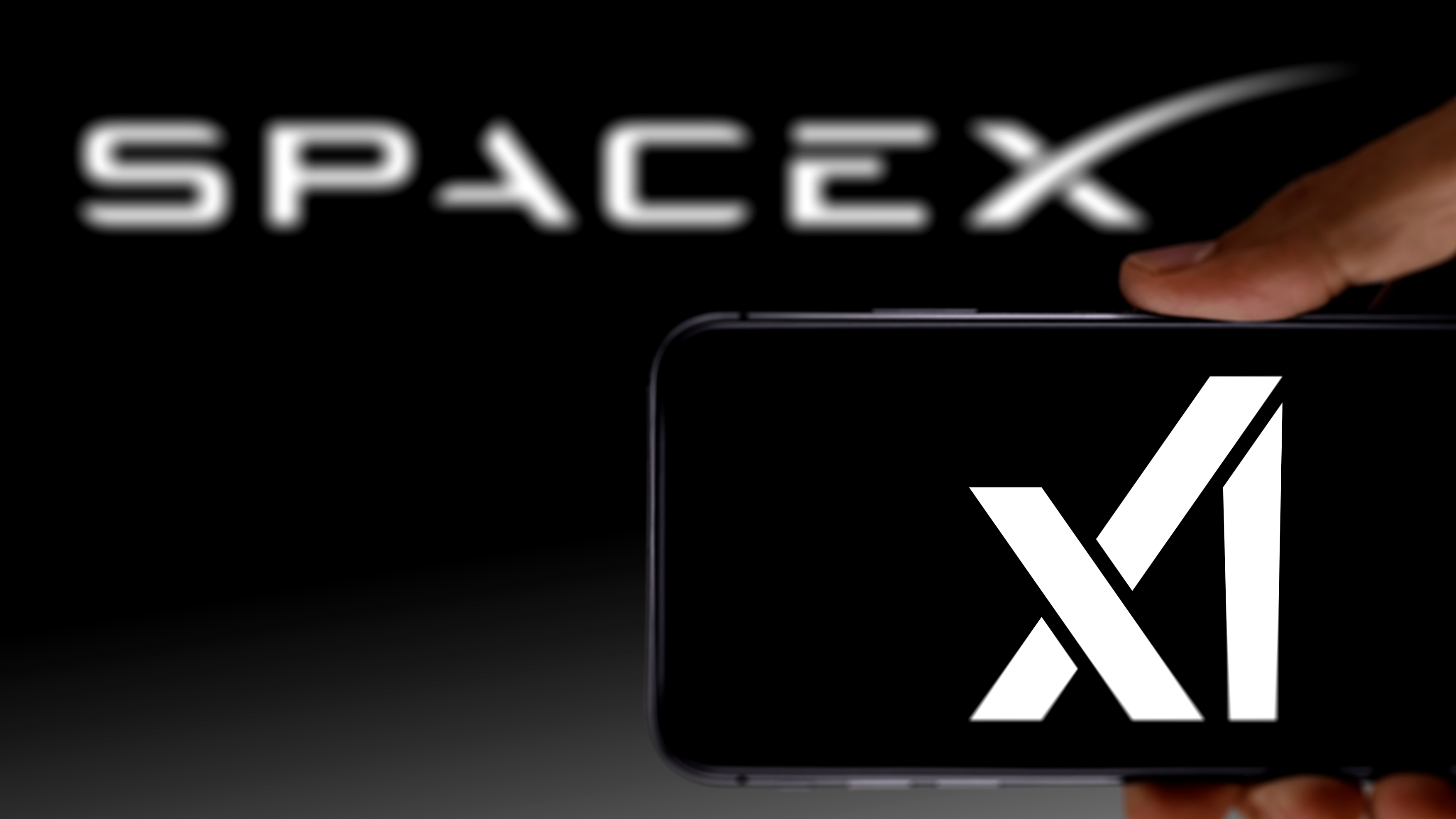 The SpaceX logo with the xAI logo in the foreground. /VCG