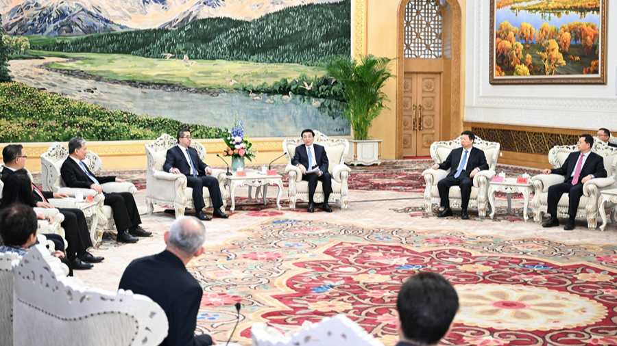 Wang Huning, a member of the Standing Committee of the Political Bureau of the Communist Party of China (CPC) Central Committee and chairman of the National Committee of the Chinese People's Political Consultative Conference, meets with a visiting Chinese Kuomintang (KMT) party delegation led by its vice chairman, Hsiao Hsu-tsen, in Beijing, China, February 4, 2026. /Xinhua