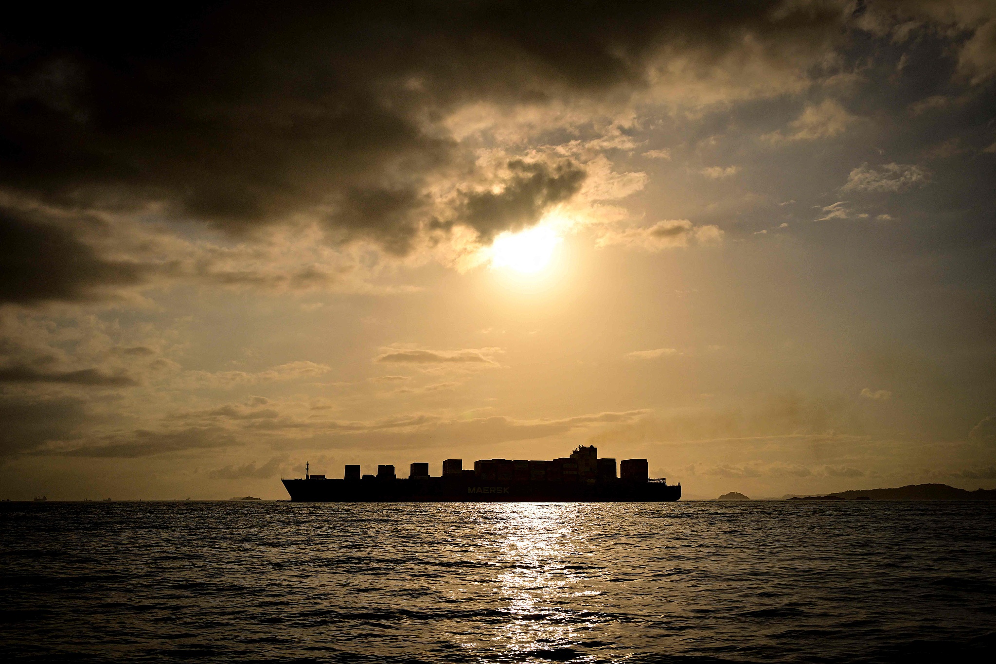 A cargo ship waits its turn to cross the Panama Canal during sunset in Panama City,  December 30, 2025. / CFP