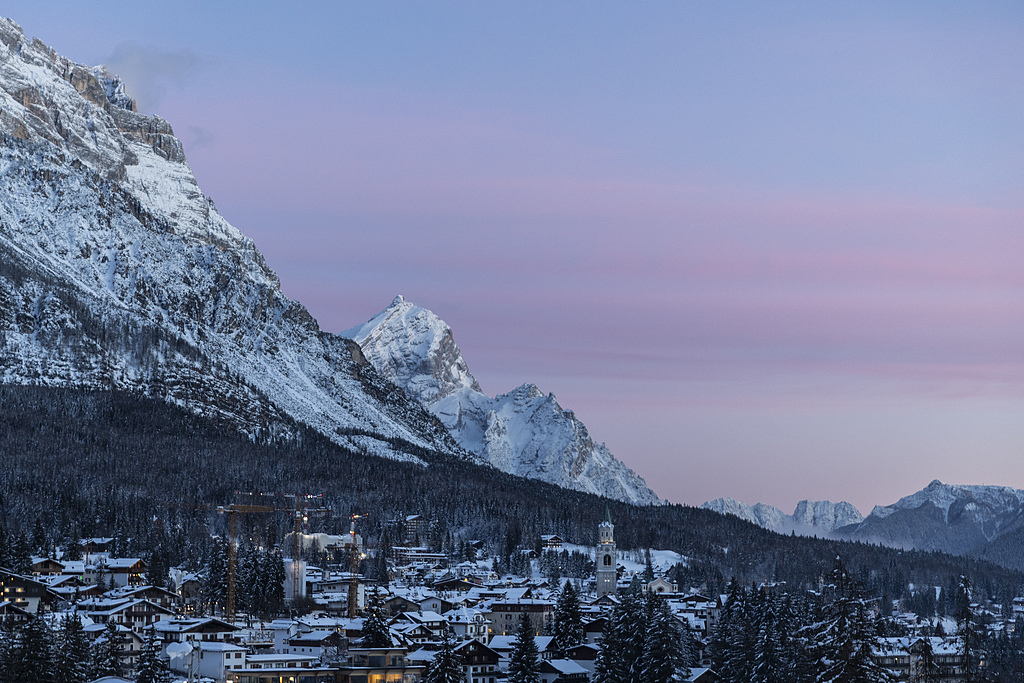 General view on the Cortina d'Ampezzo covered in snow during sunset ahead of the 2026 Milano Cortina Winter Olympics, January 26, 2026. /VCG
