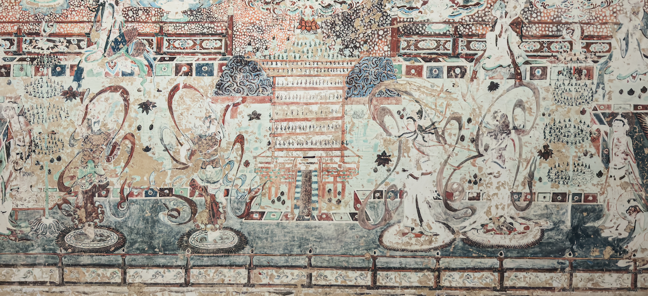 The lower part of the mural in Mogao Cave 220 in Dunhuang shows four Hu Xuan dancers performing on rugs. /Dunhuang Academy