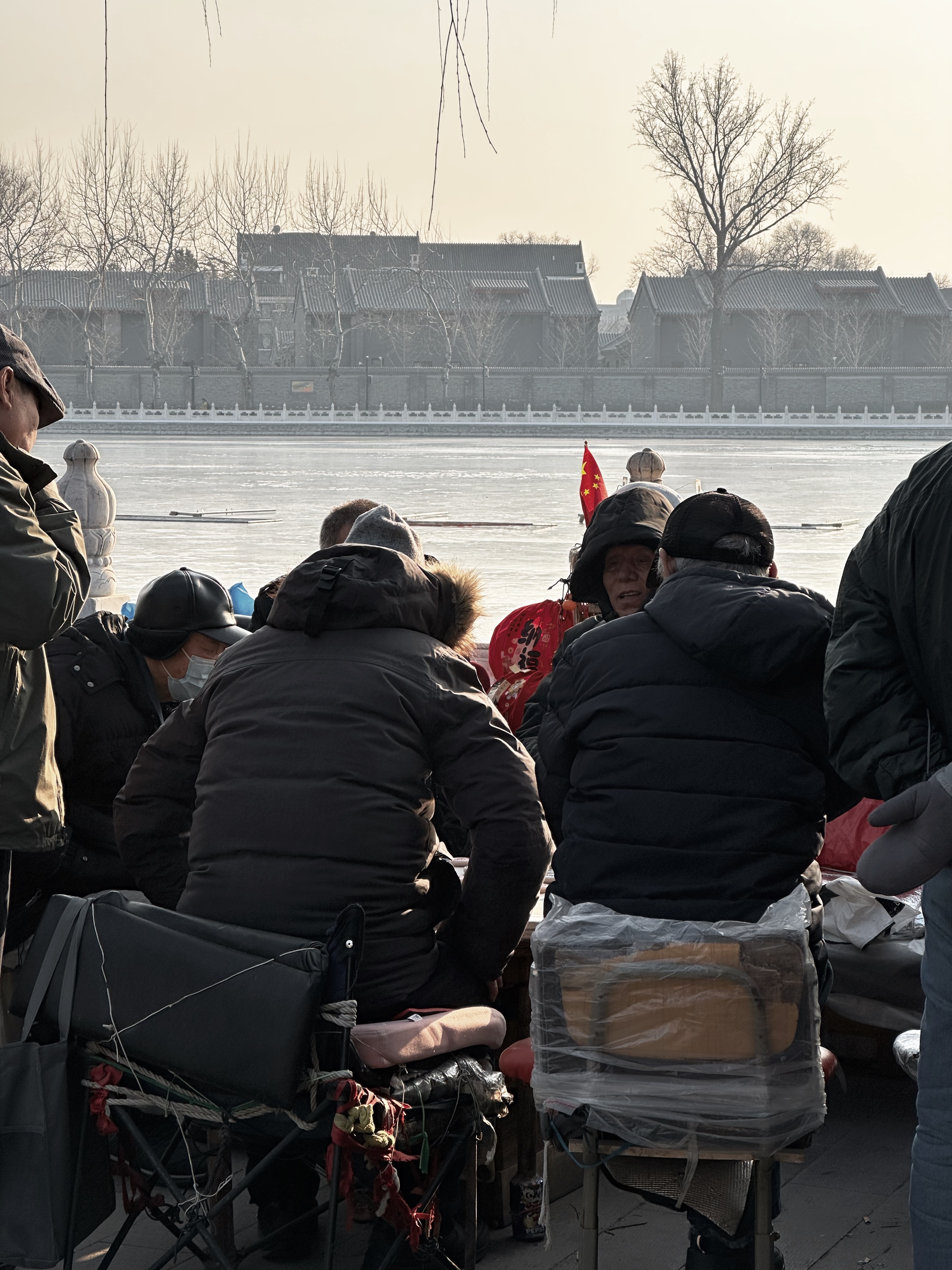 Retirees defy Beijing's freezing winter with vibrant outdoor activities at Shichahai. /CGTN