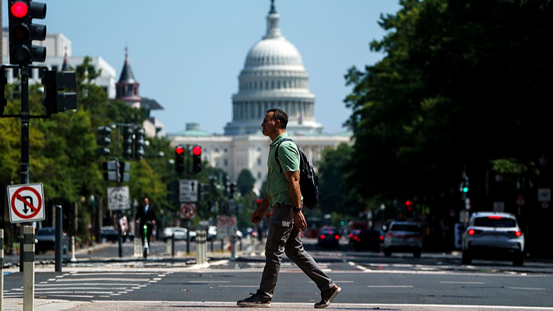 A citizen walks across Pennsylvania Avenue in front of the Washington, D.C., U.S., September 5, 2025. /CFP