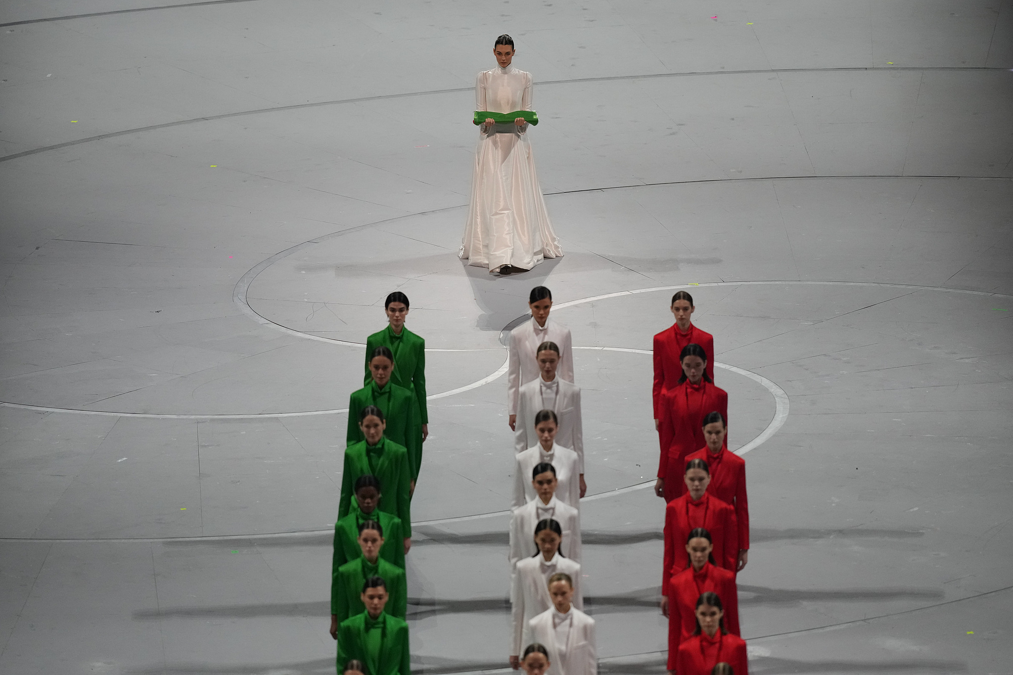 Italian model Vittoria Ceretti (top) carries the host nation's flag during the opening ceremony at the 2026 Milano Cortina Winter Olympics in Milan, Italy, February 6, 2026. /VCG