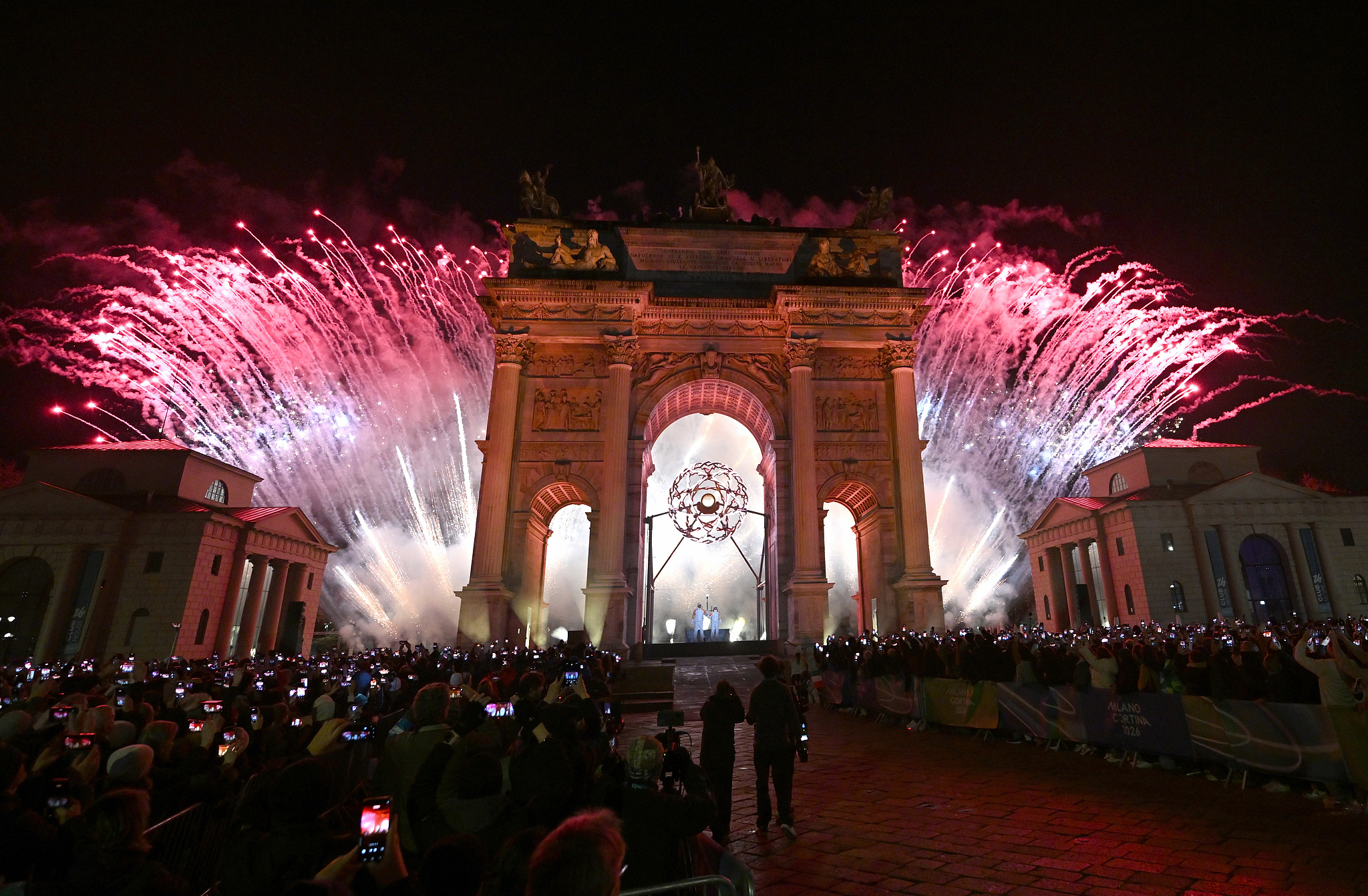 Fireworks explode near the Arco della Pace during the opening ceremony at the 2026 Milano Cortina Winter Olympics in Milan, Italy, February 6, 2026. /VCG