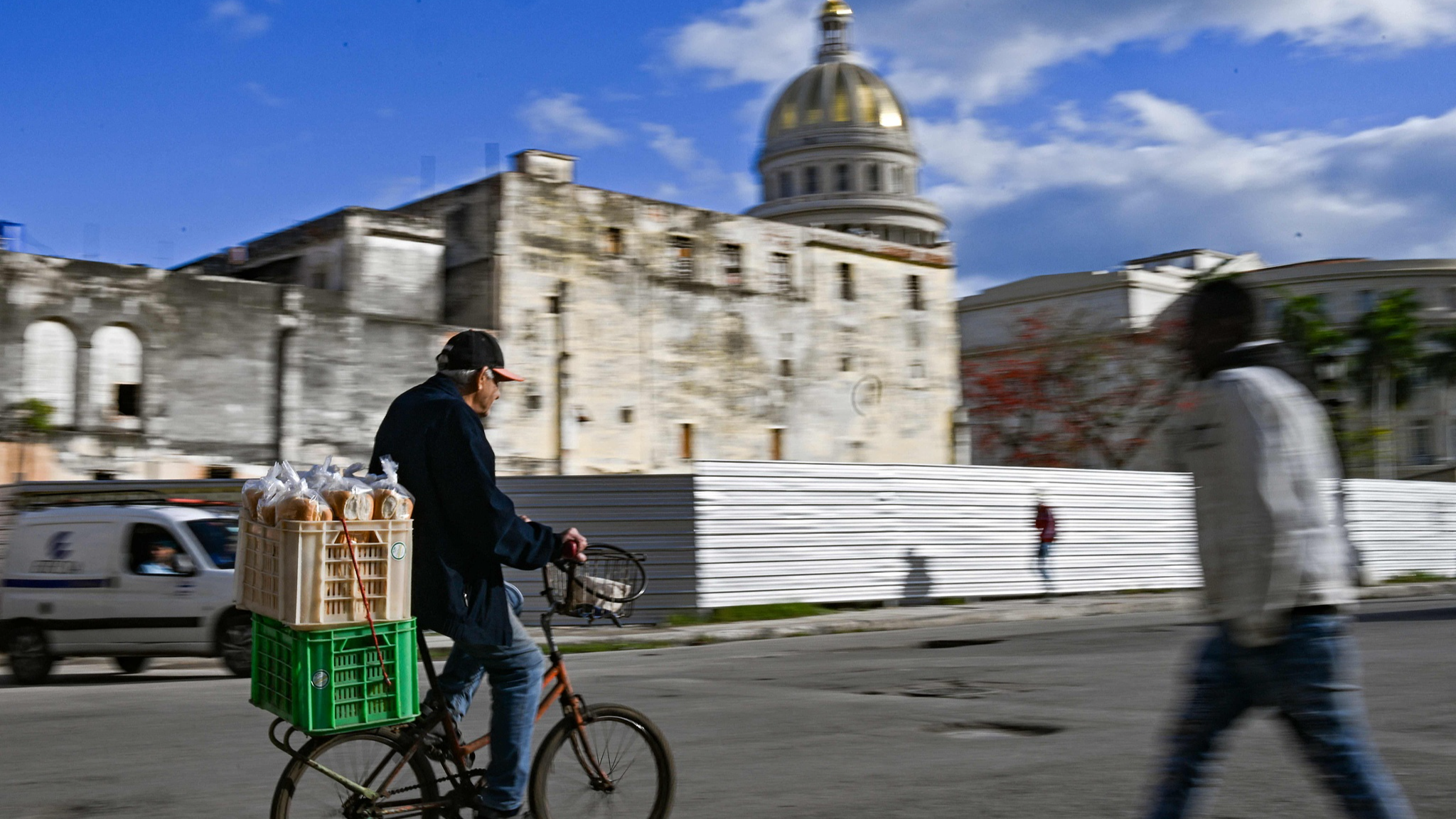 A man rides a bicycle along a street in Havana, Cuba, with the Capitol in the background, February 6, 2026. /VCG