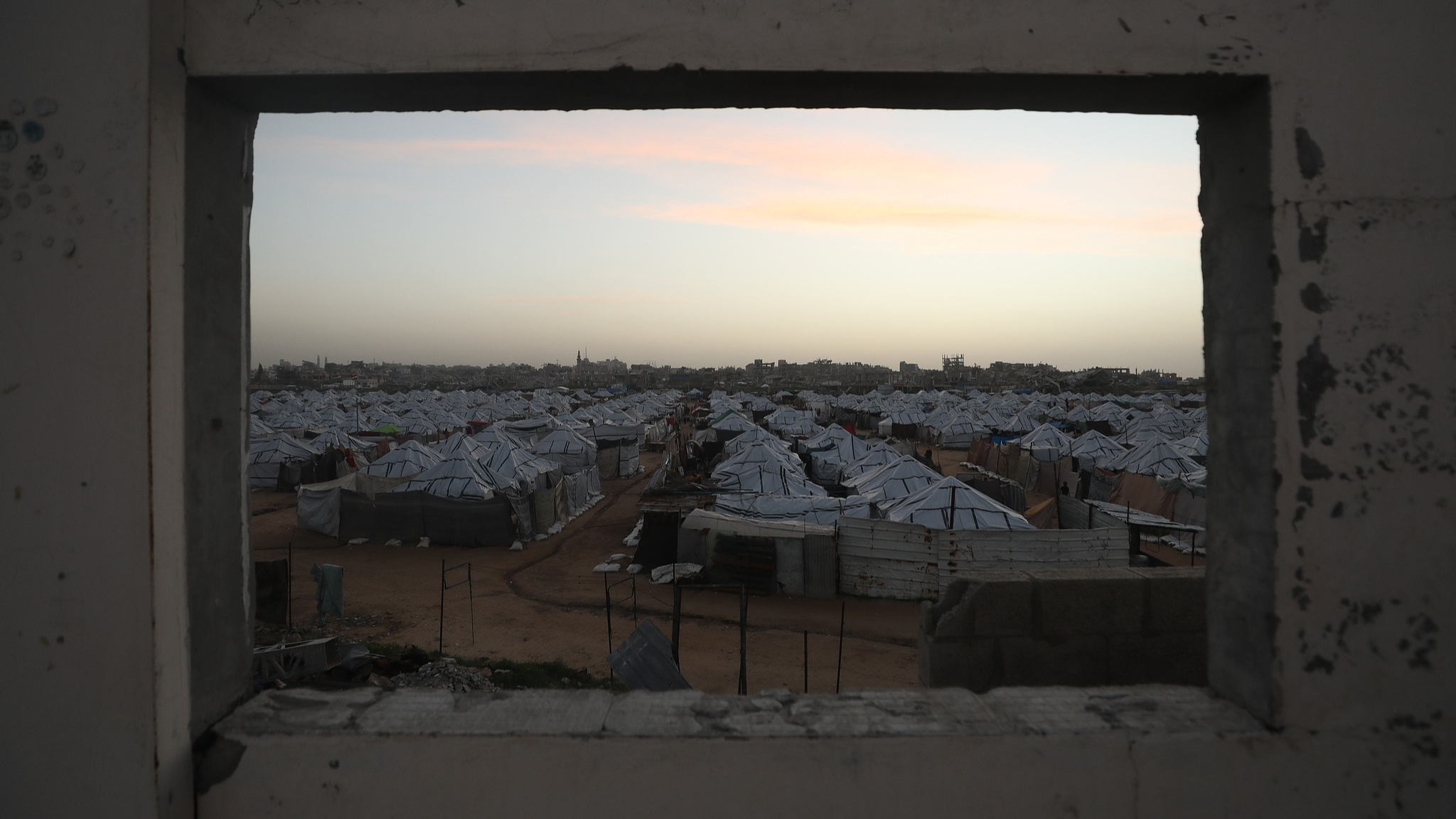 Displaced civilians in the Nuseirat Refugee Camp in the central Gaza Strip are struggling to survive under harsh conditions in makeshift tents set up among the rubble, February 8, 2026. /VCG