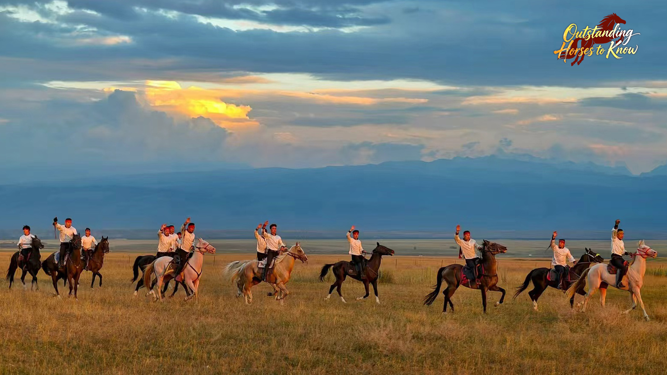 A wide shot of riders waving hands on the grassland in Zhaosu County of northwest China's Xinjiang Uygur Autonomous Region, July 17, 2025. /VCG