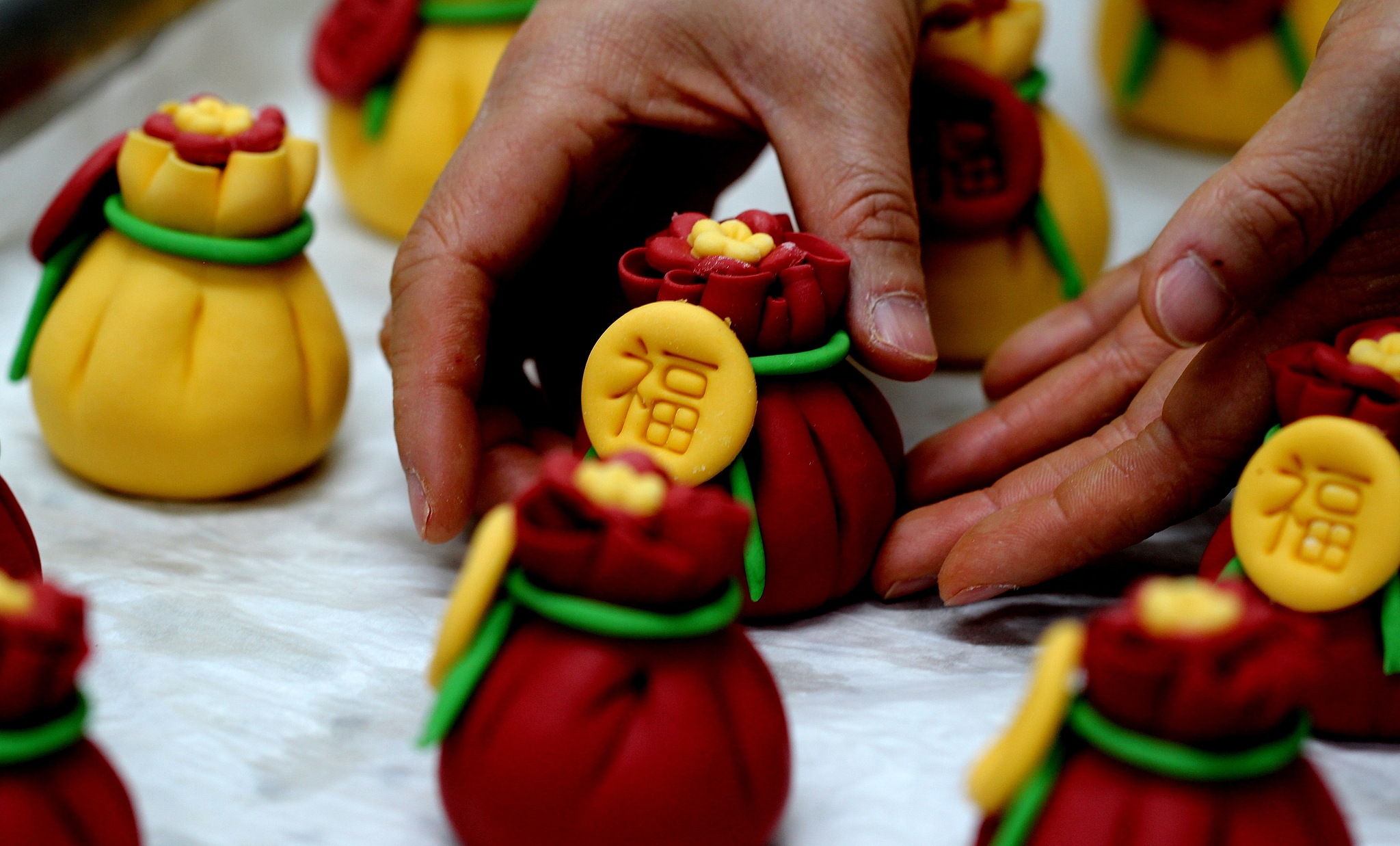 People prepare decorated steamed buns featuring horse motifs on in preparation for the Year of the Horse, Huimin County, east China's Shandong Province, January 30, 2026. /CFP
