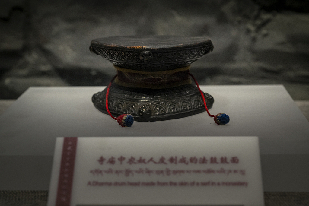 A drum, allegedly made from the skin of a serf, housed in the Xizang Museum. /VCG