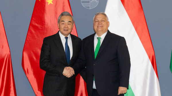 Wang Yi (L), member of the Political Bureau of the Communist Party of China Central Committee and Chinese foreign minister, meets with Hungarian Prime Minister Viktor Orban in Budapest, Hungary, February 11, 2026. 