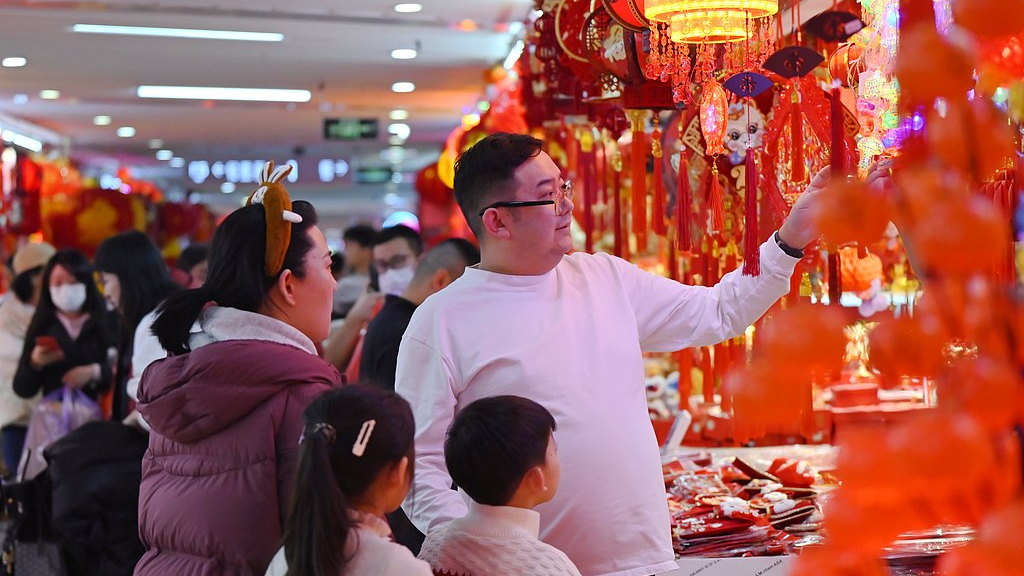 Shoppers pick out Spring Festival decorations at a shopping mall in Beijing, capital of China, February 11, 2026. /VCG