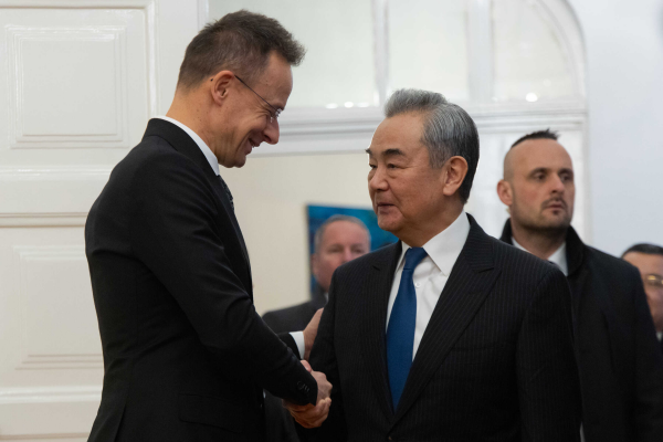 China's Foreign Minister Wang Yi (R) shaking hands with Hungarian Minister of Foreign Affairs and Trade Peter Szijjarto (L) during a meeting in Budapest, Hungary, February 12, 2026. /MOFA