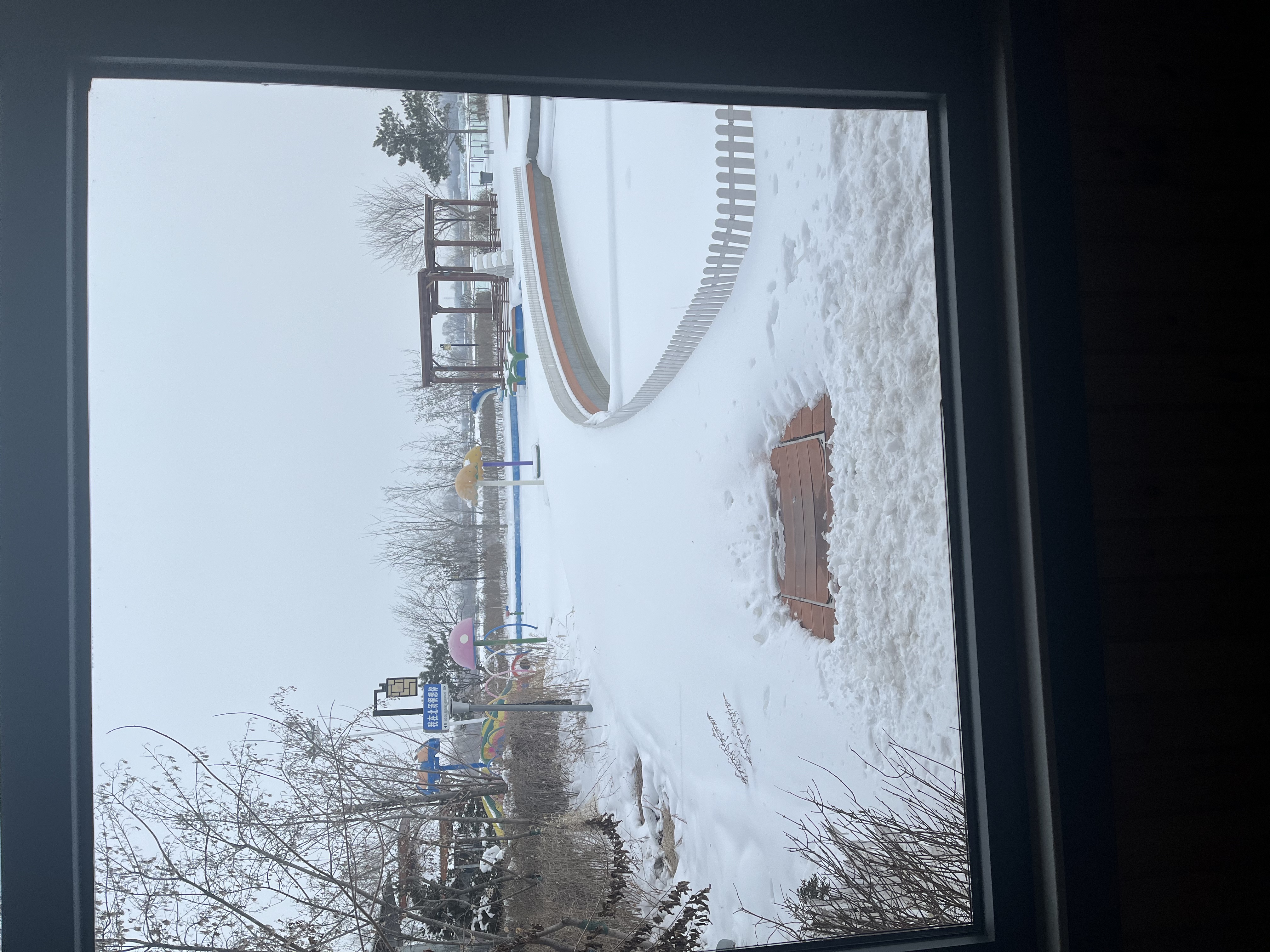 A snowy landscape is seen from a window at the Beitang Hot Spring Resort in Shenyang, Liaoning Province, on February 6, 2025. /CGTN