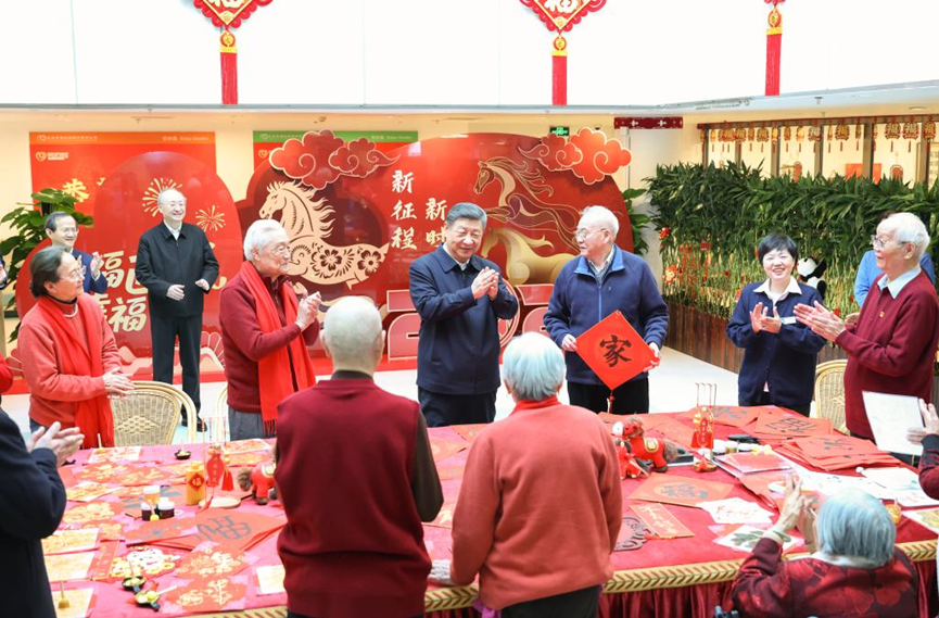 Chinese President Xi Jinping talks with elderly residents while visiting an apartment complex for seniors in Xicheng District of Beijing, capital of China, February 10, 2026. /Xinhua
