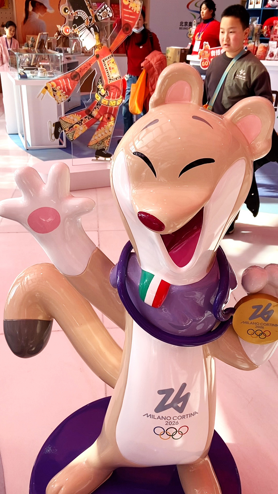 A statue of Tina, the stoat mascot of the Milano Cortina 2026 Winter Olympics, is seen at the Beijing Olympic Museum. /CGTN