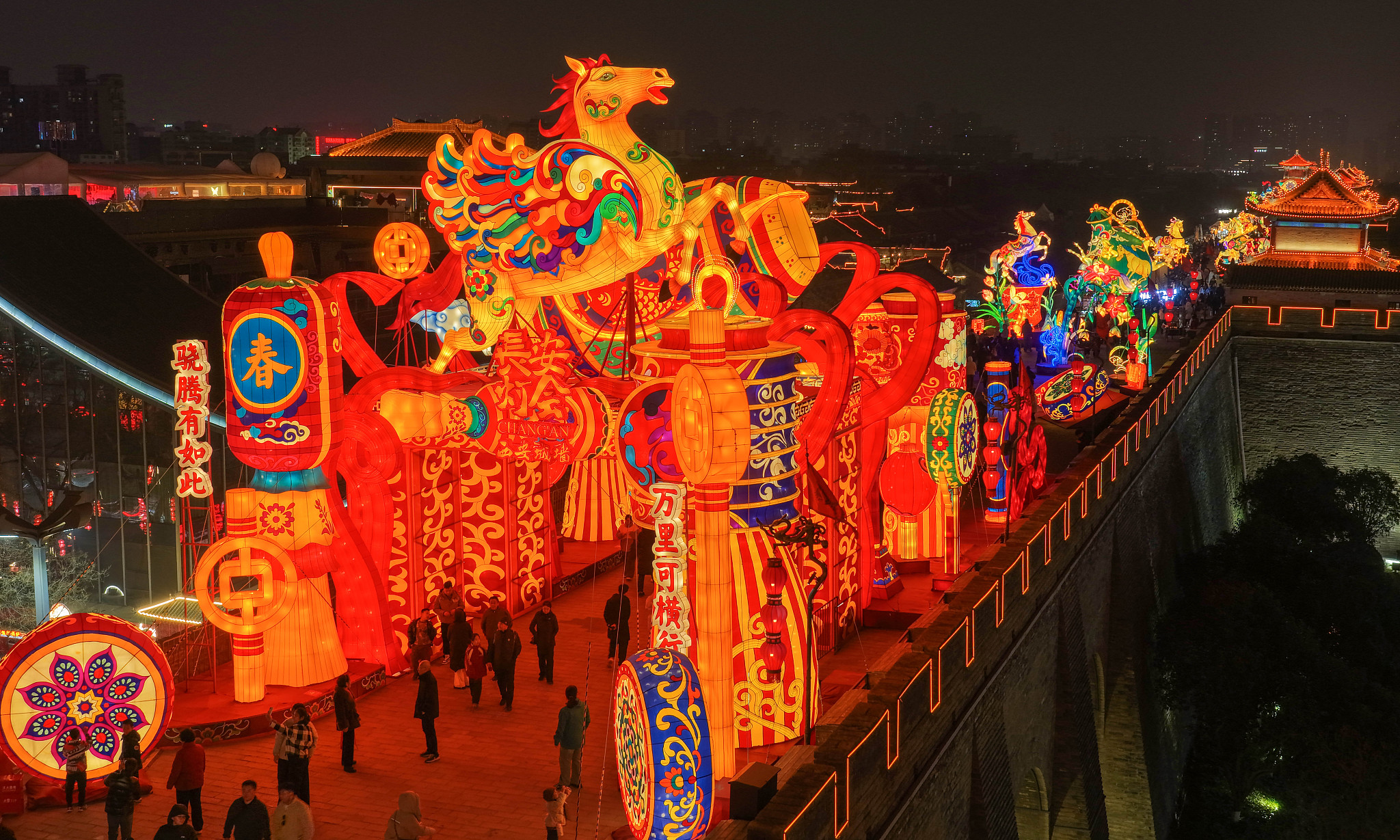 Tourists visit the lantern show at the Xi'an City Wall Scenic Area, experiencing the strong festive atmosphere of the Spring Festival, in Xi'an, northwest China's Shaanxi Province, February 6, 2026. /VCG