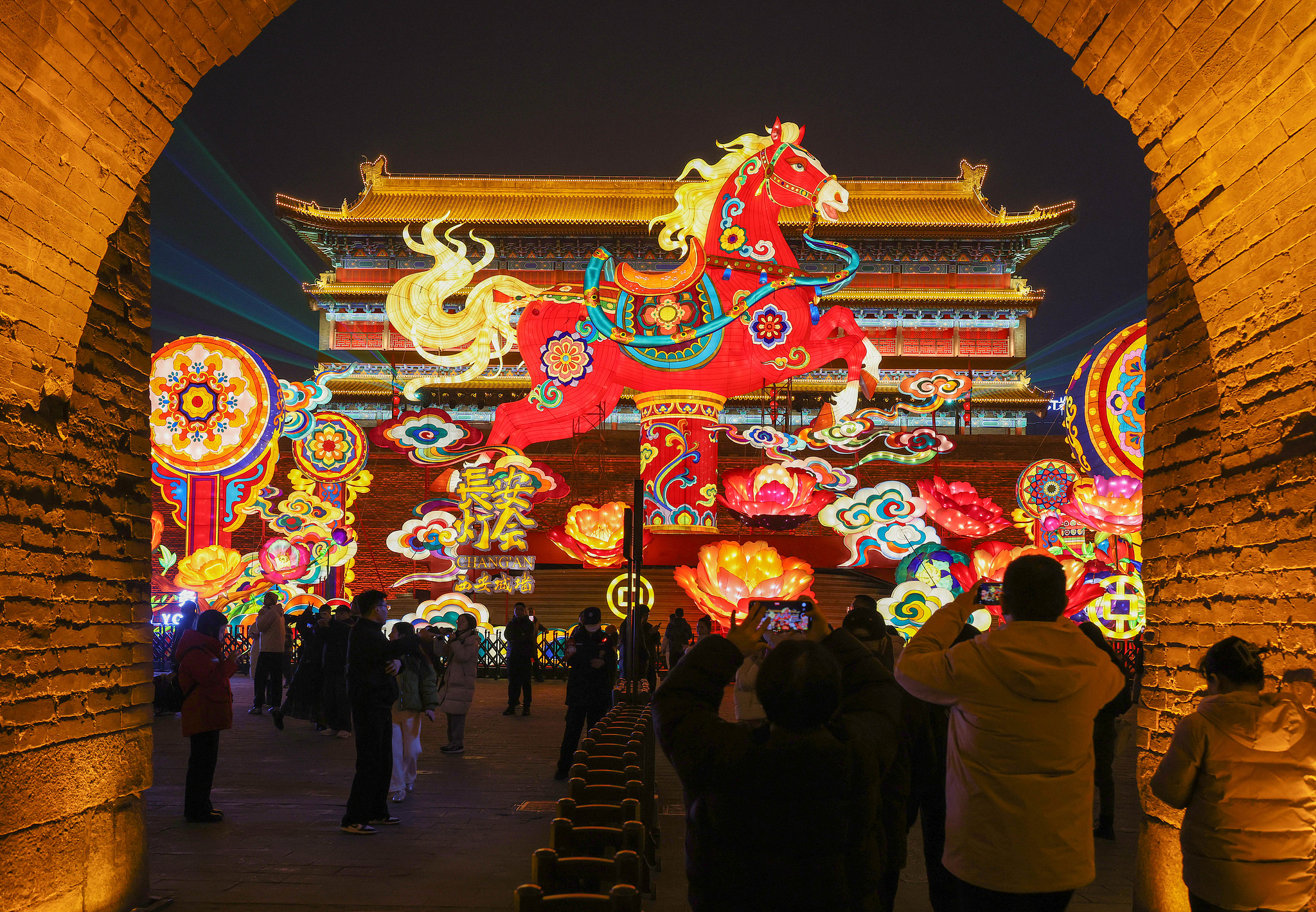 Tourists visit the lantern show at the Xi'an City Wall Scenic Area, experiencing the strong festive atmosphere of the Spring Festival, in Xi'an, Shaanxi Province, February 6, 2026. /VCG
