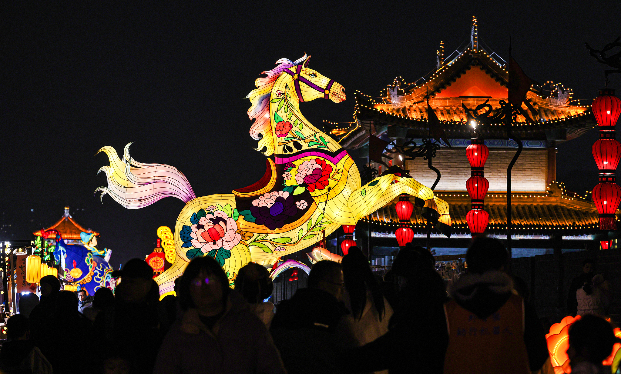 Tourists visit the lantern show at the Xi'an City Wall Scenic Area, experiencing the strong festive atmosphere of the Spring Festival, in Xi'an, Shaanxi Province, February 6, 2026. /VCG