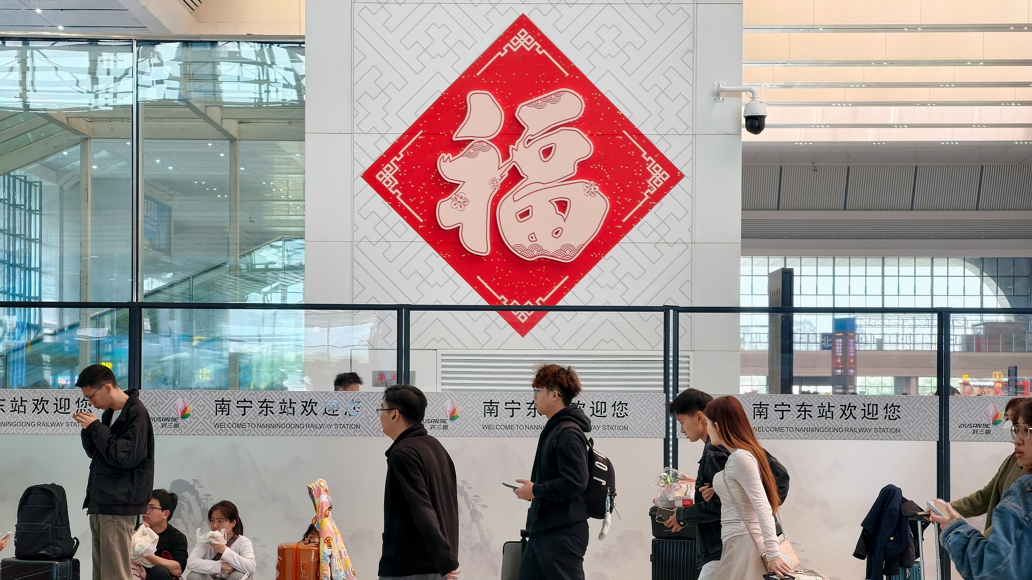 Passengers wait in the departure hall at Nanning East railway station, Nanning, Guangxi Province, China, February 14, 2026. /VCG