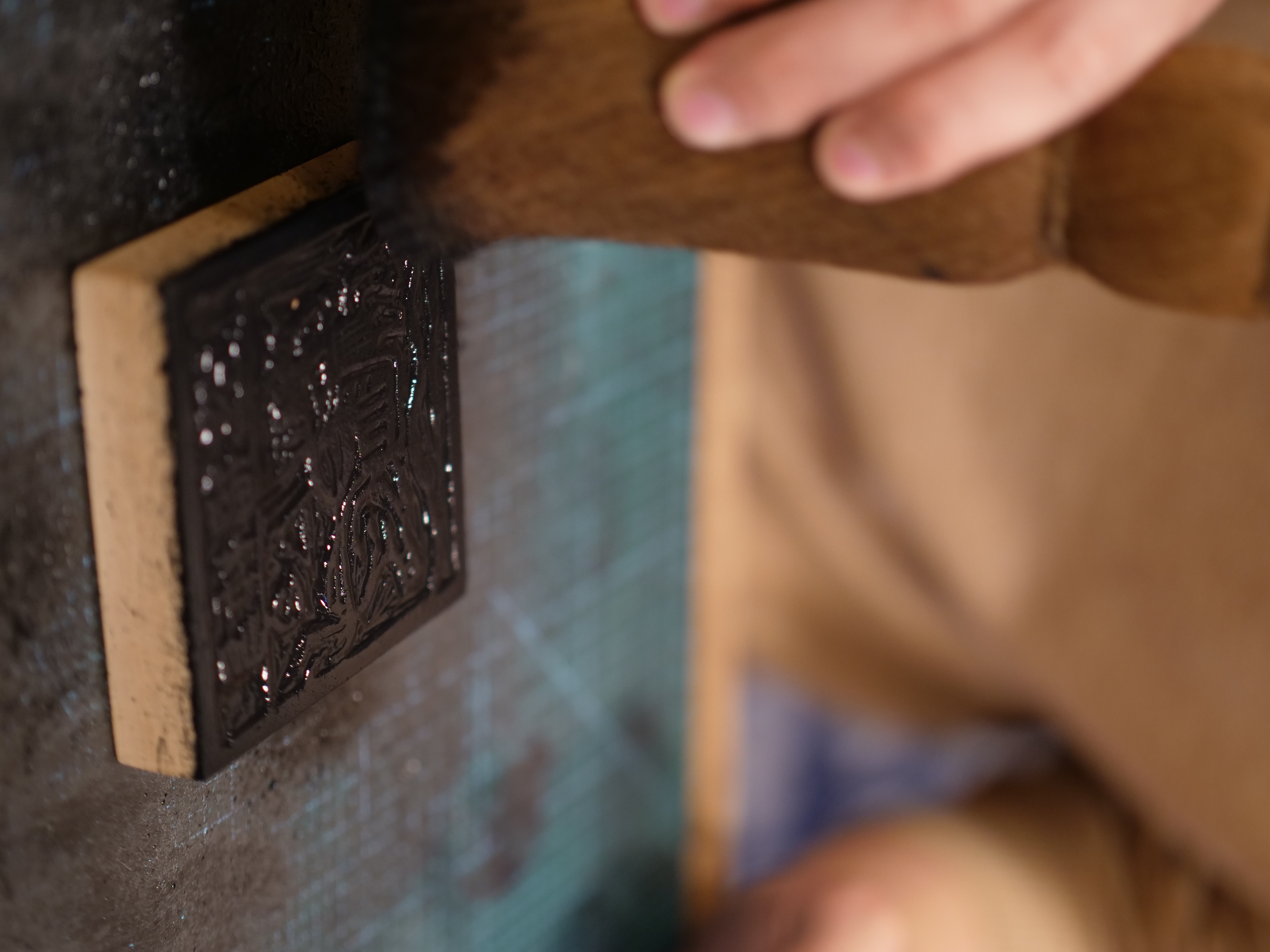 Ink is then applied to the wooden block and pressed onto paper to print the desired image. /CGTN